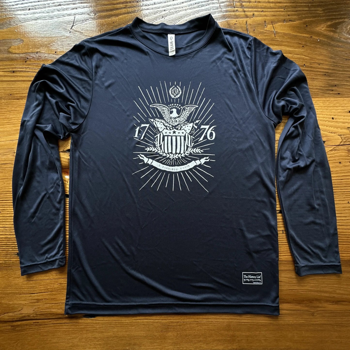 1776 "E Pluribus Unum" on moisture-wicking 100% polyester interlock with SPF 40+ UV protection - Long-sleeved from The History List Store.