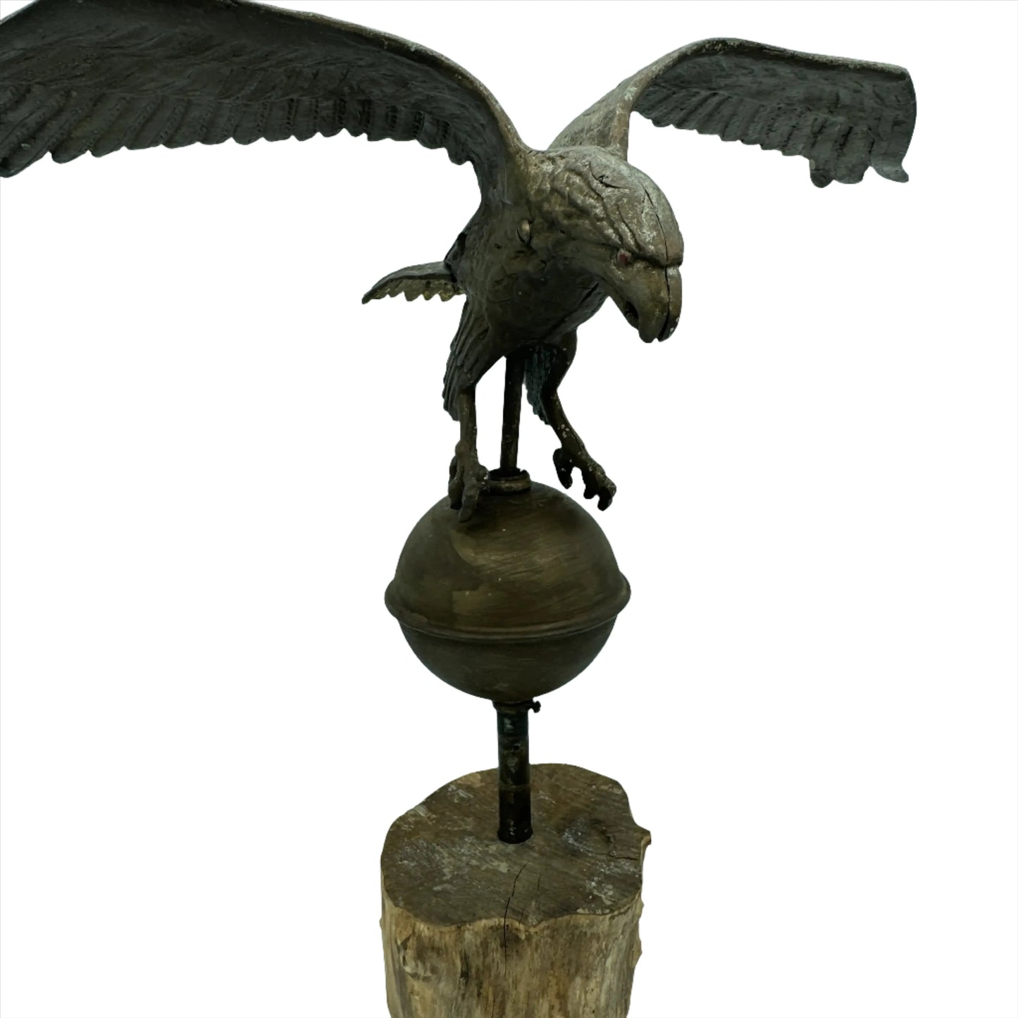 Mounted metal eagle atop a ball and wooden base