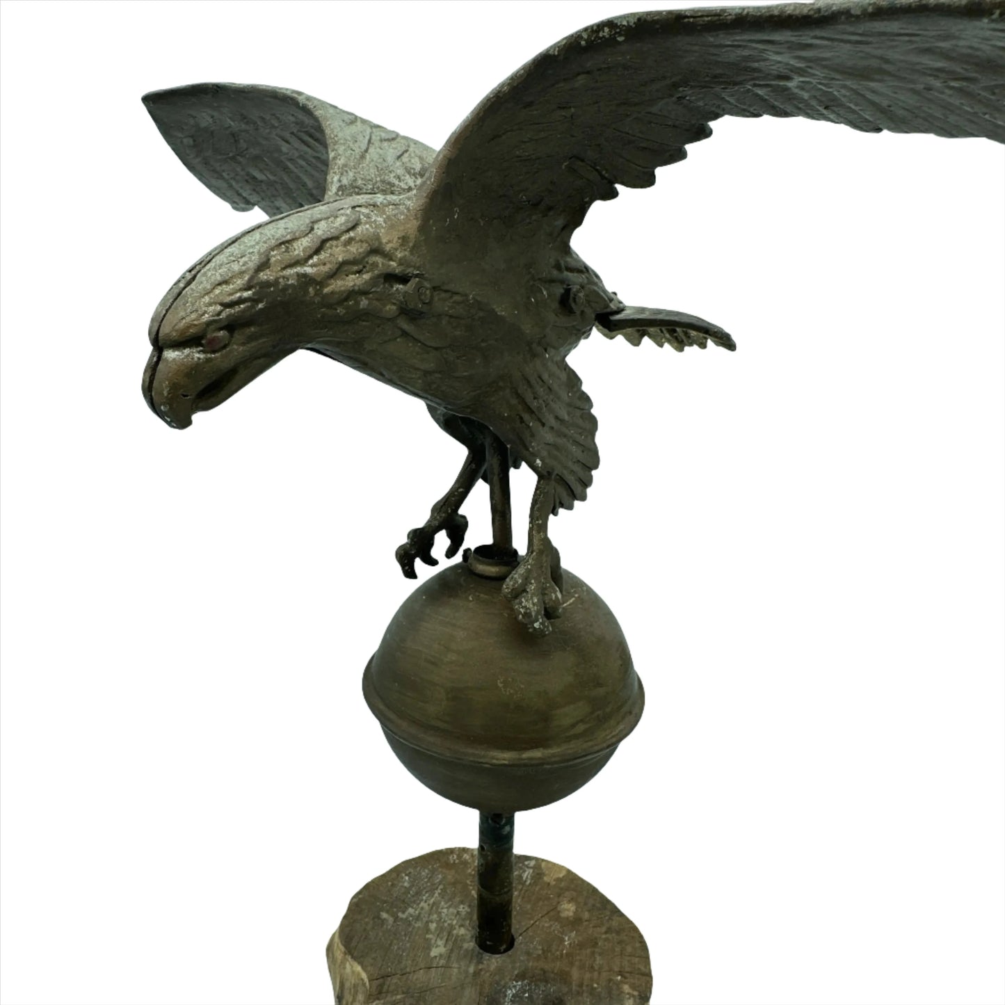Mounted metal eagle atop a ball and wooden base