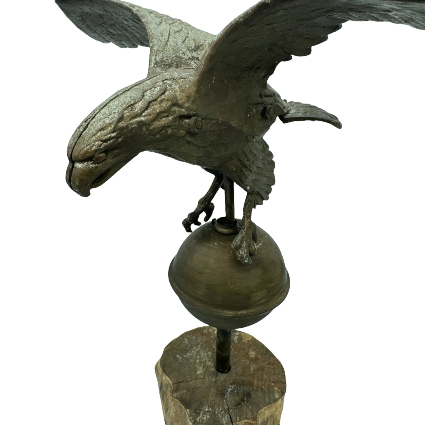 Mounted metal eagle atop a ball and wooden base
