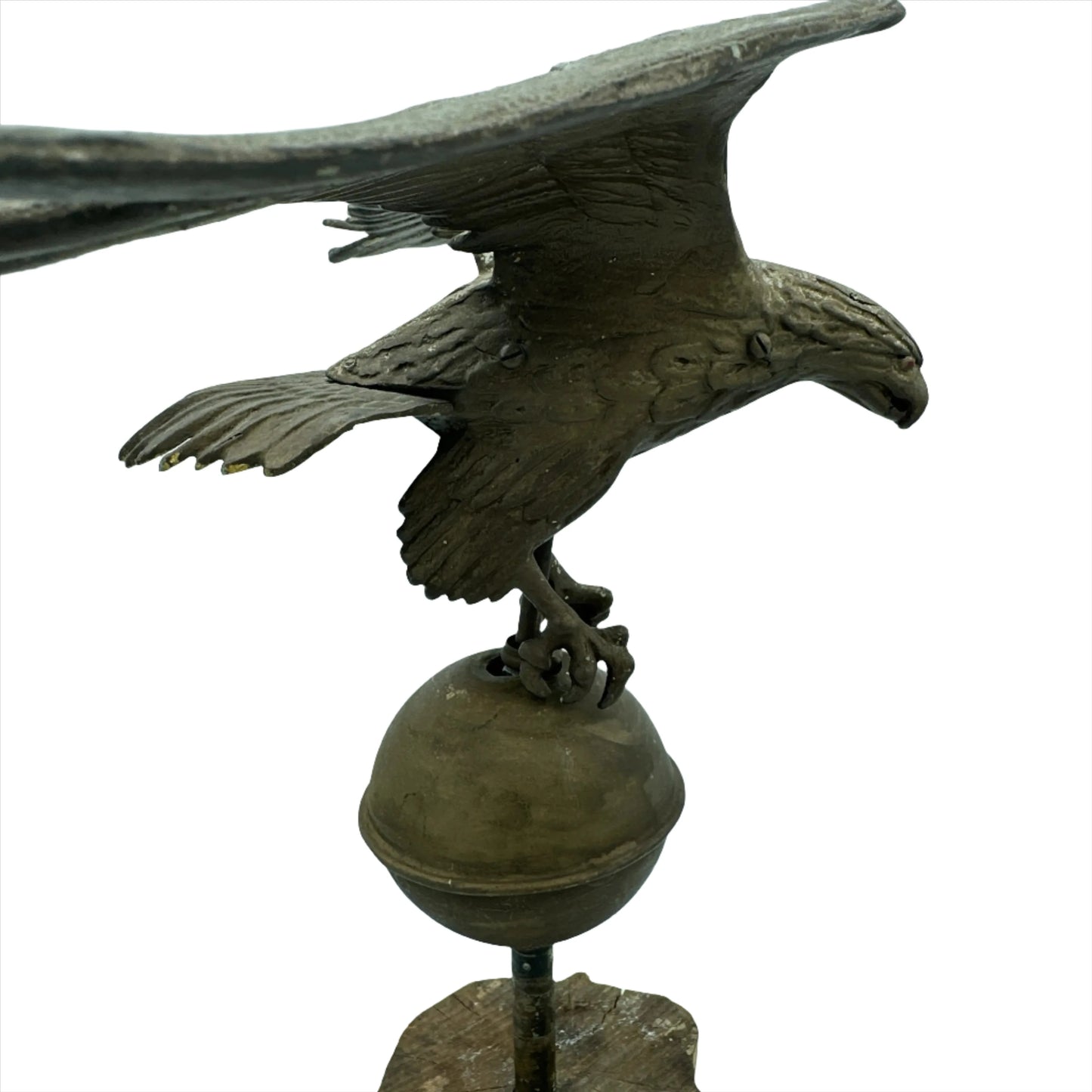 Mounted metal eagle atop a ball and wooden base