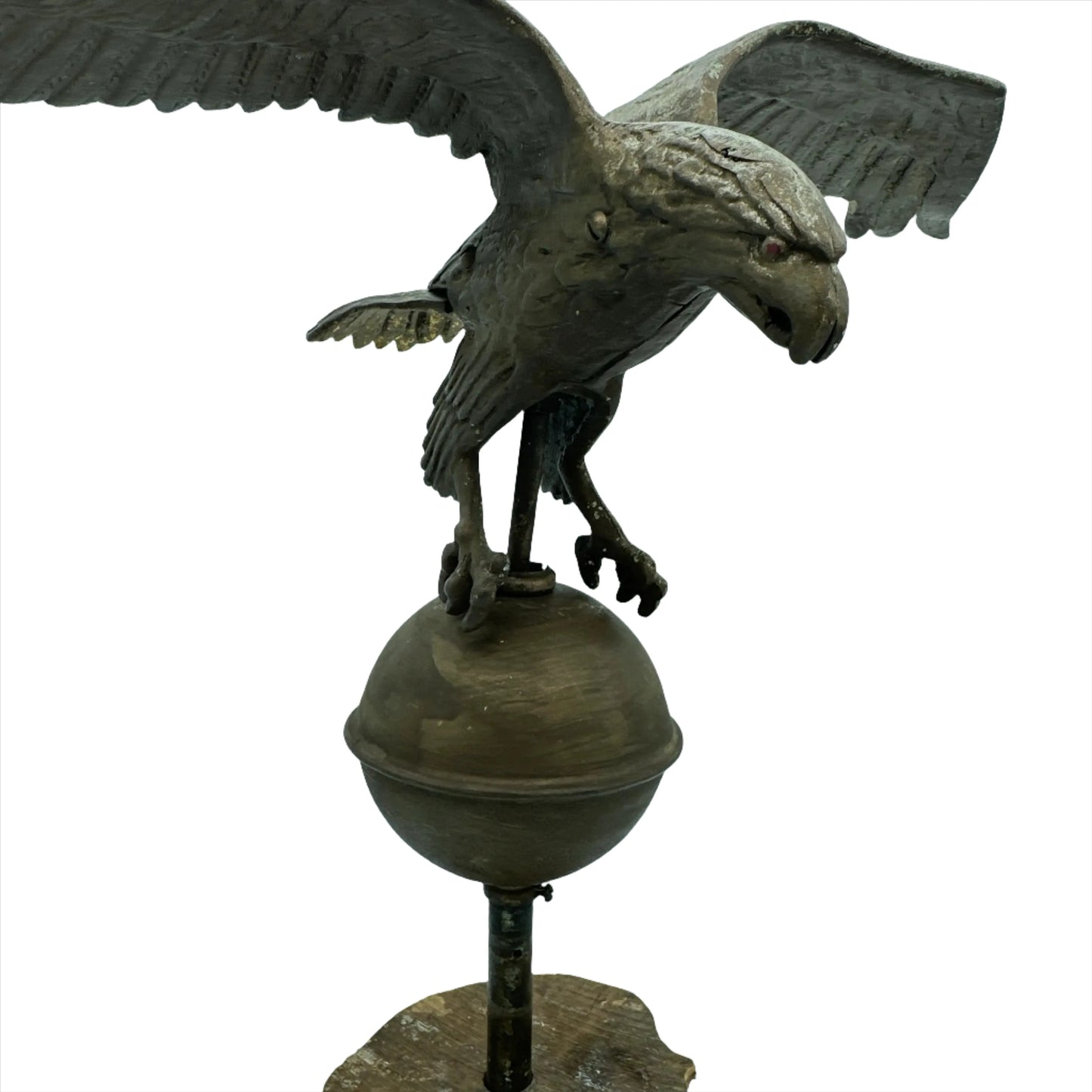Mounted metal eagle atop a ball and wooden base