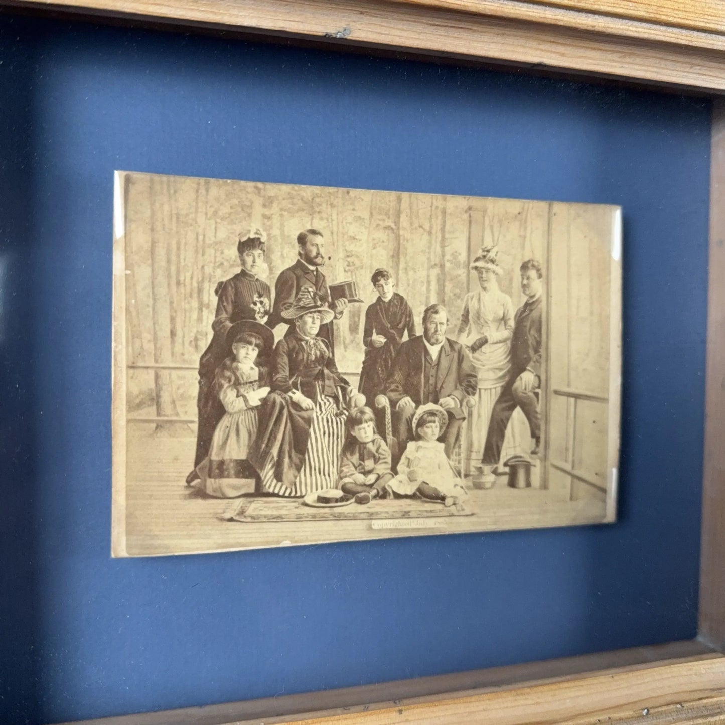 Photograph of Grant and his family on their porch shortly before his death — Framed