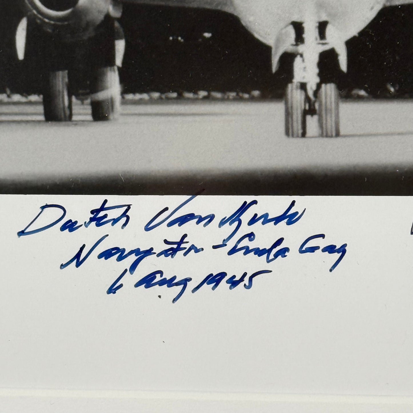 Photo of the Enola Gay signed by the pilot, navigator, and weapons officer — with COA