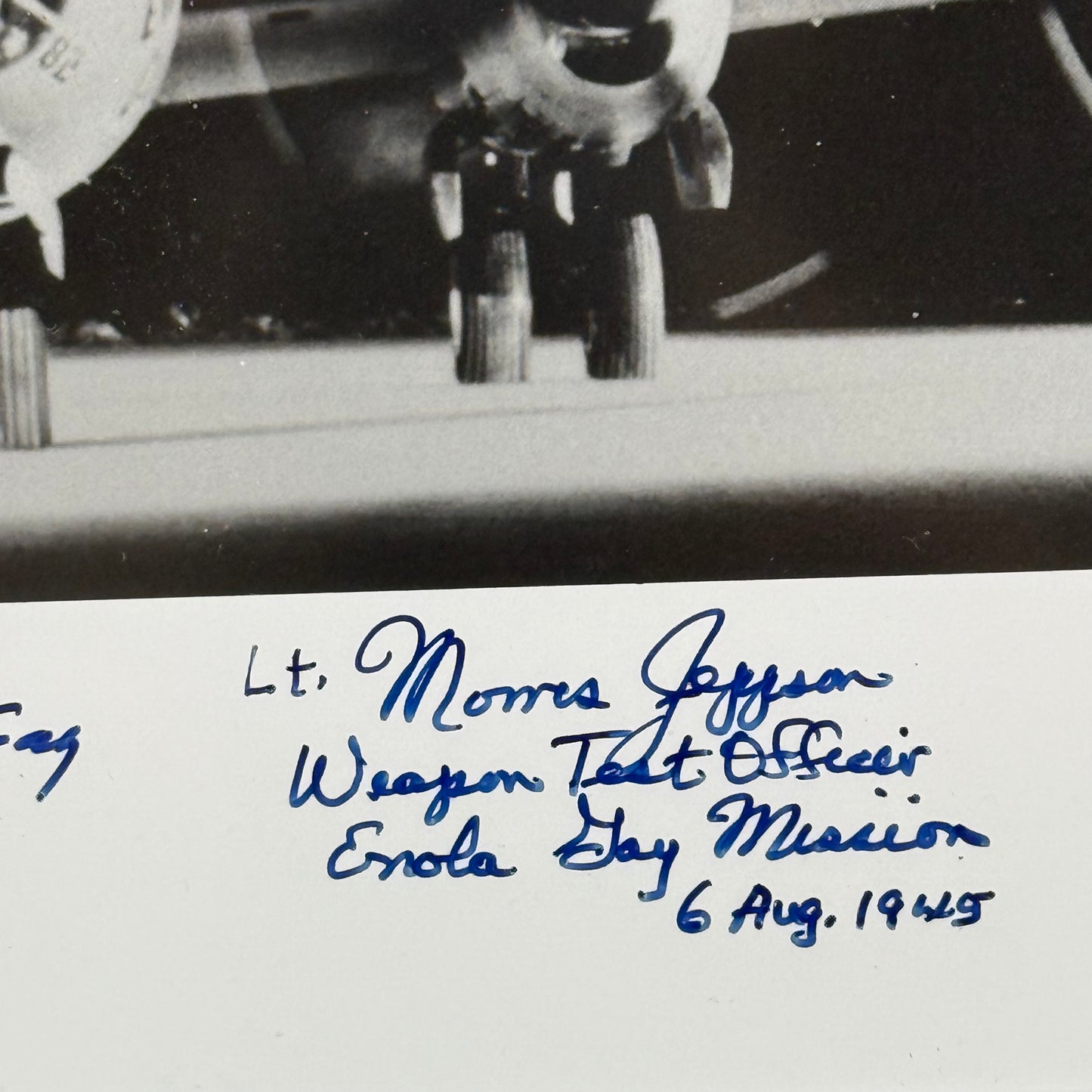 Photo of the Enola Gay signed by the pilot, navigator, and weapons officer — with COA