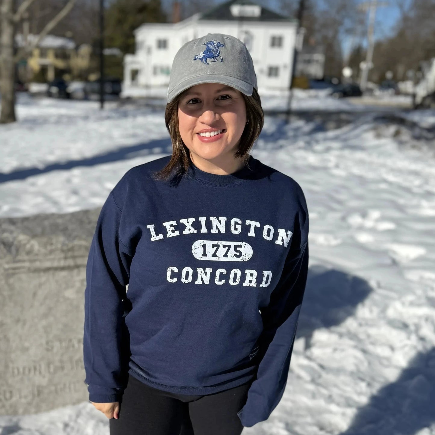 Larisa wearing the 1775 Lexington and Concord Crewneck sweatshirt from The History List Store.