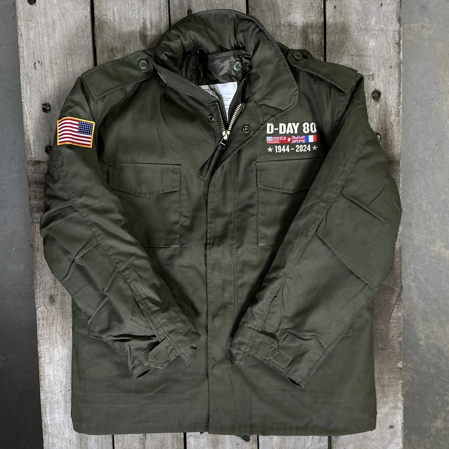 Front of the M65 Army field coats with original D-Day 80th Anniversary design and a 48-star flag from The History List Store.