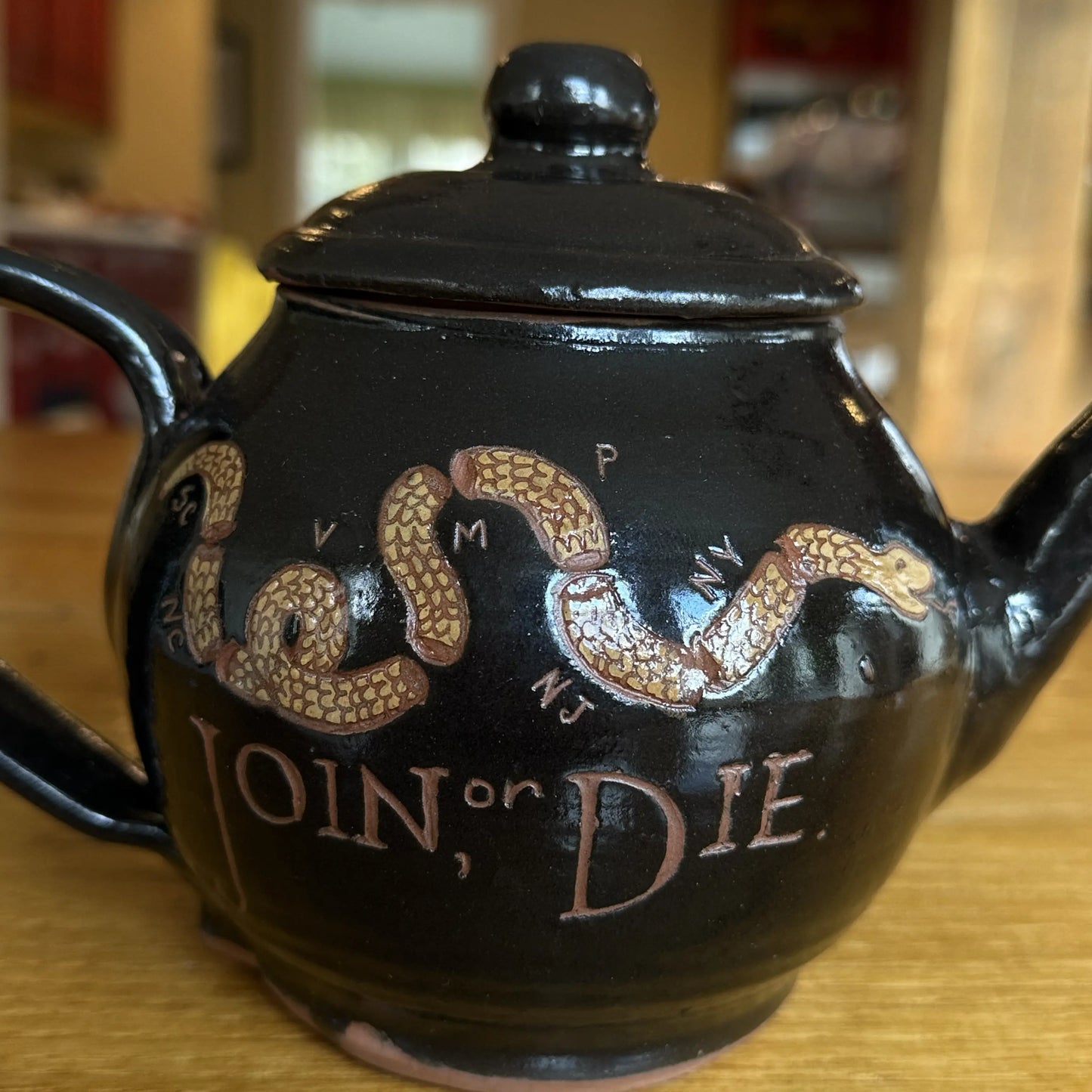 Close-up of the "Join or Die" Teapot — Traditional redware made by hand in America from The History List store