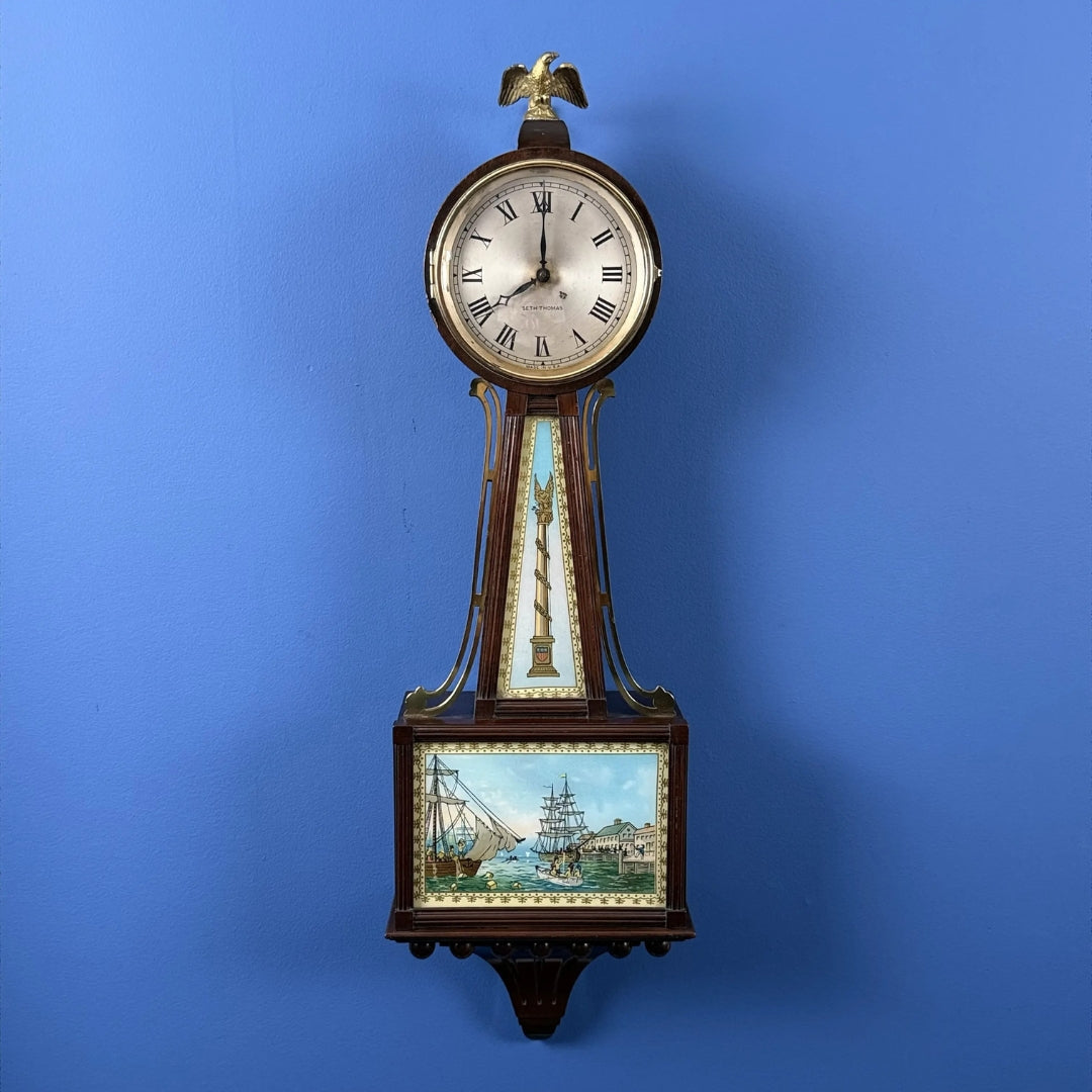 Seth Thomas "Banjo Clock" showing the Boston Tea Party — Electric (possibly)
