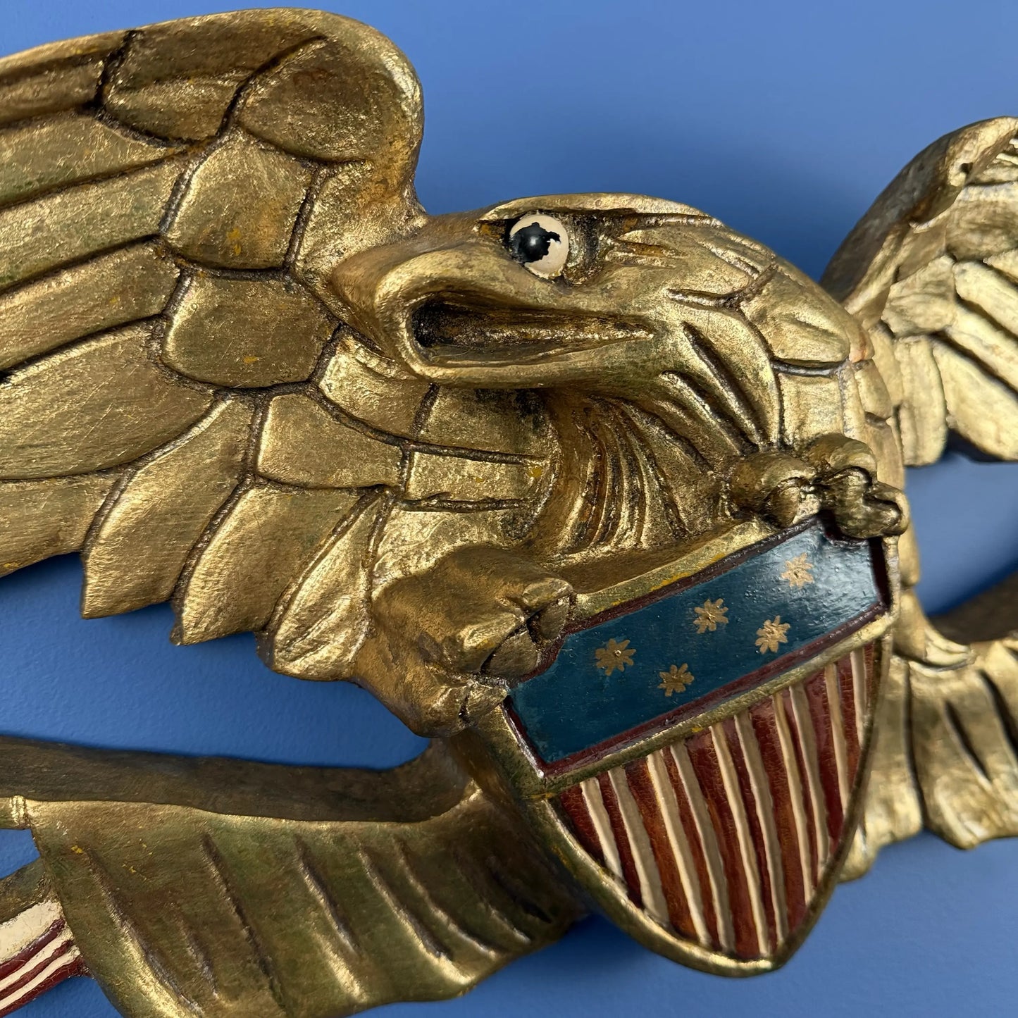 Carved wooden eagle with flag and shield — 30" wide