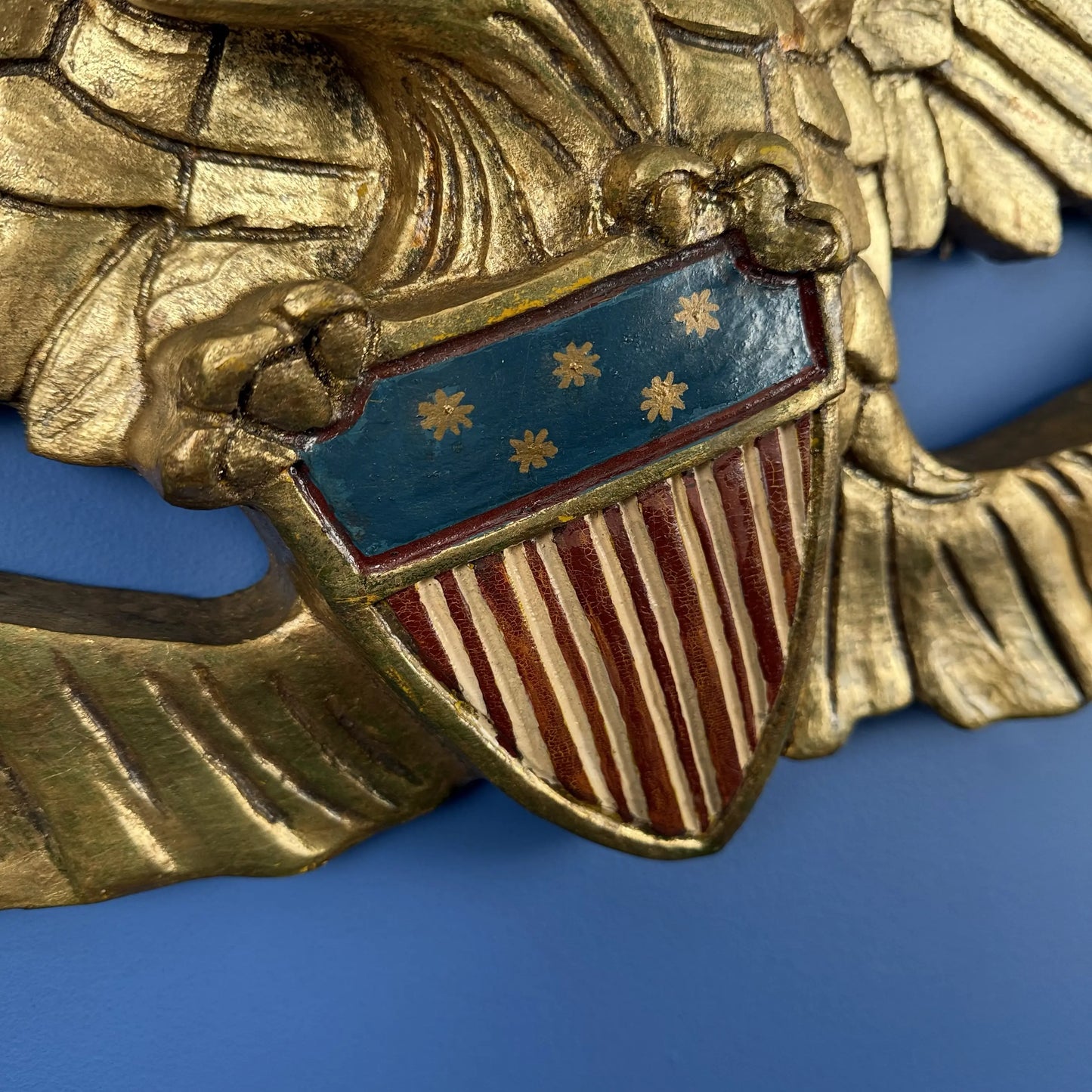 Carved wooden eagle with flag and shield — 30" wide