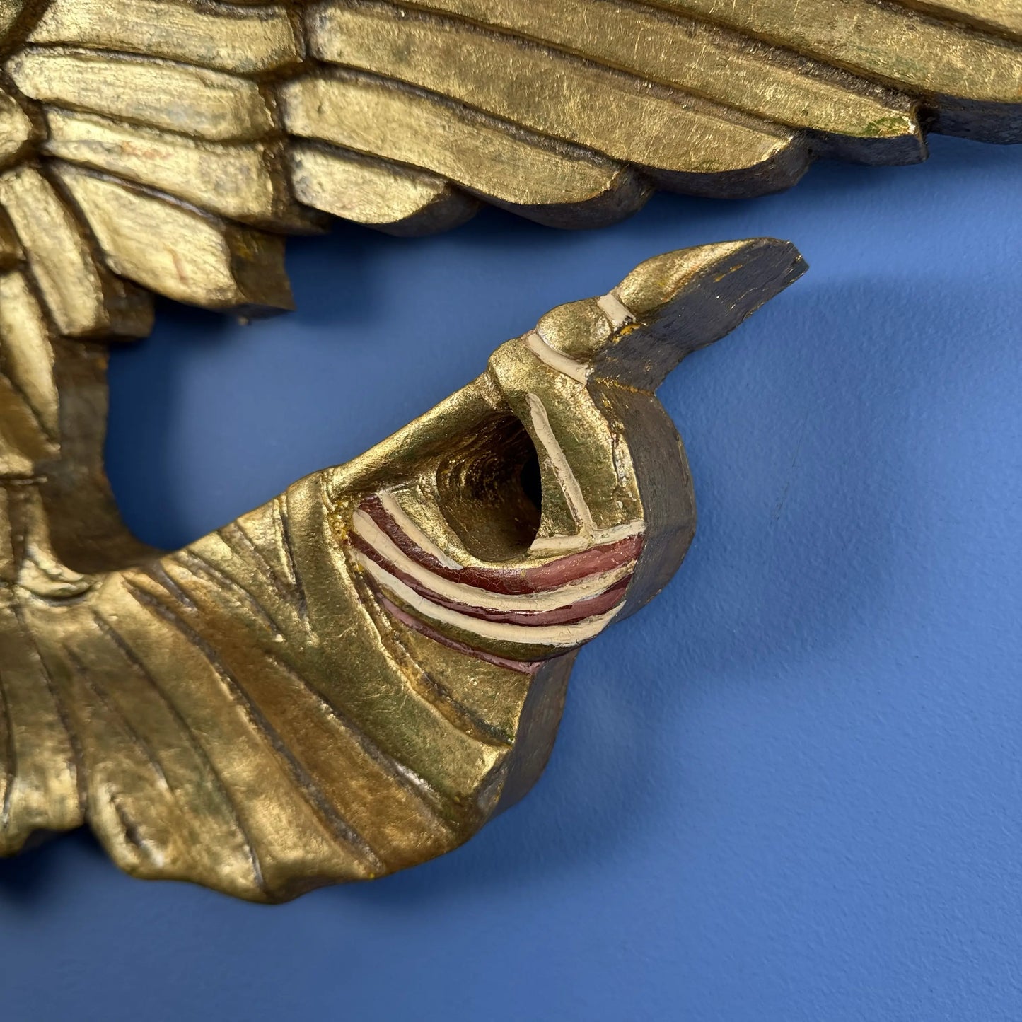 Carved wooden eagle with flag and shield — 30" wide
