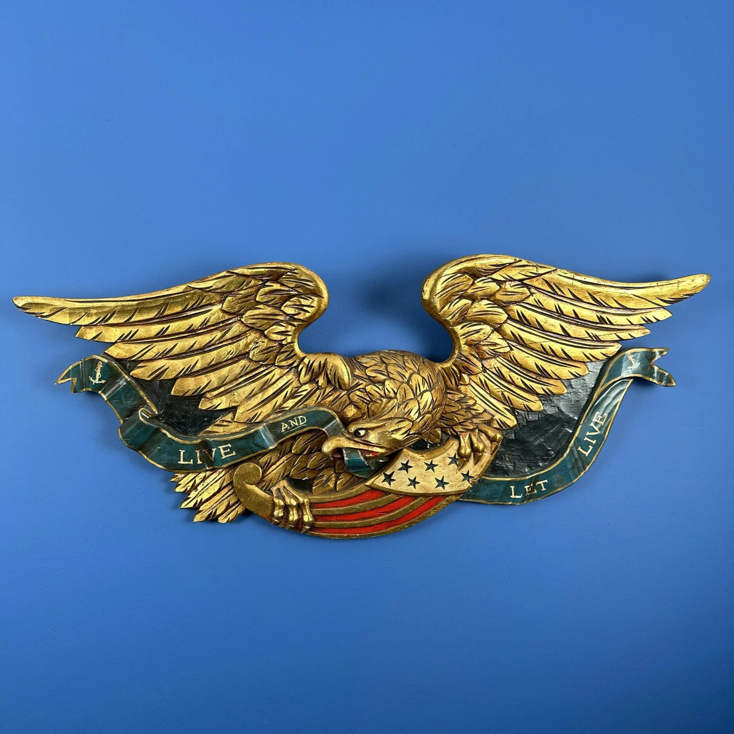 Carved wooden eagle — "Live and Let Live" — 36" wide