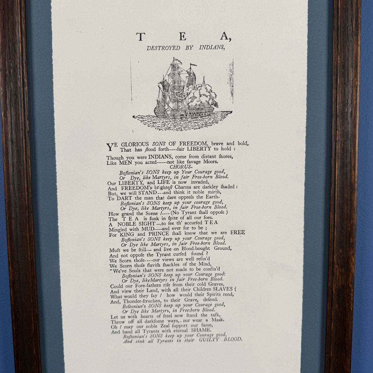 Framed "Tea Destroyed by Indians" reproduction print in an antique frame