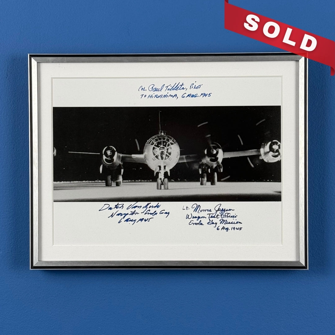 Photo of the Enola Gay signed by the pilot, navigator, and weapons officer — with COA