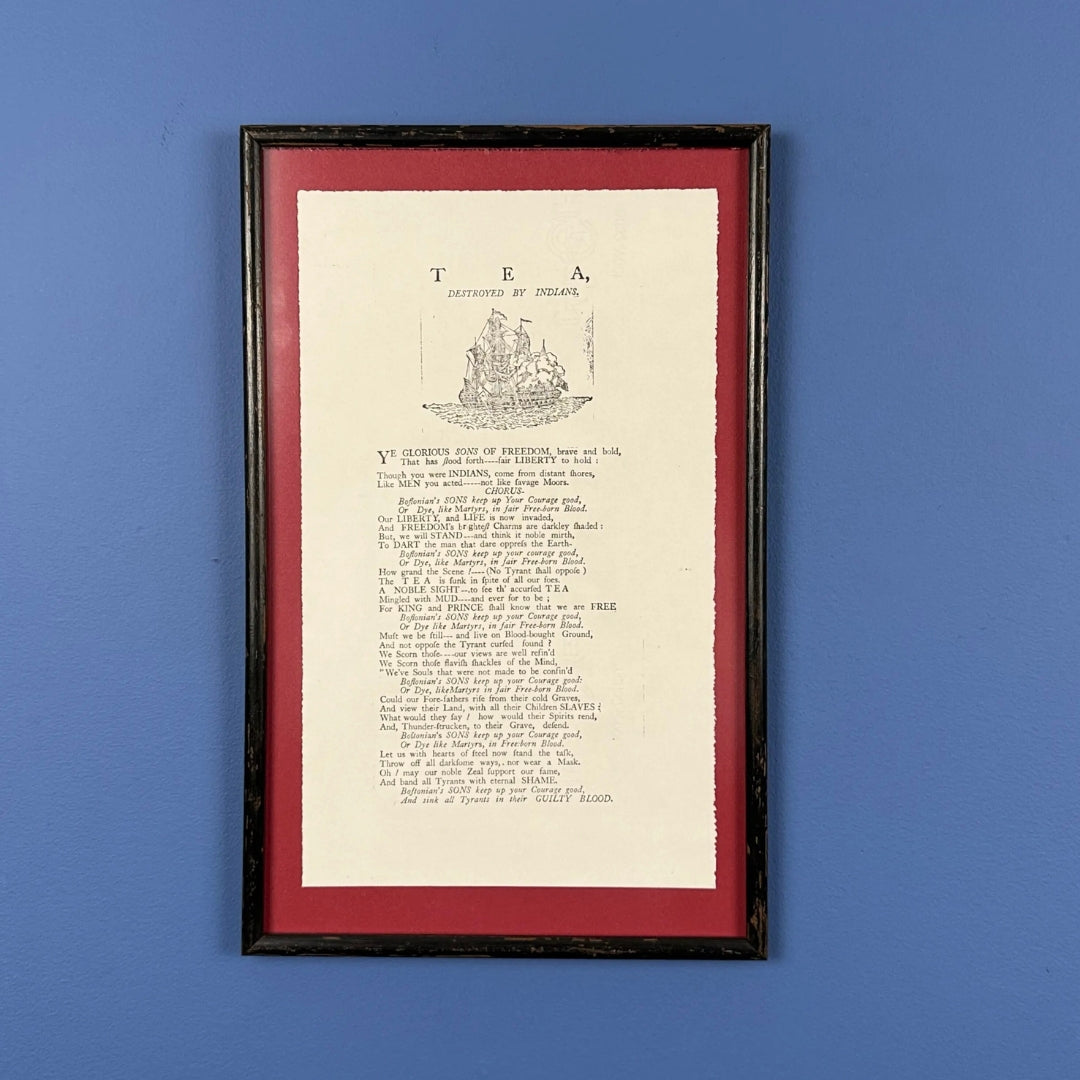 Framed "Tea Destroyed by Indians" reproduction print in an antique frame