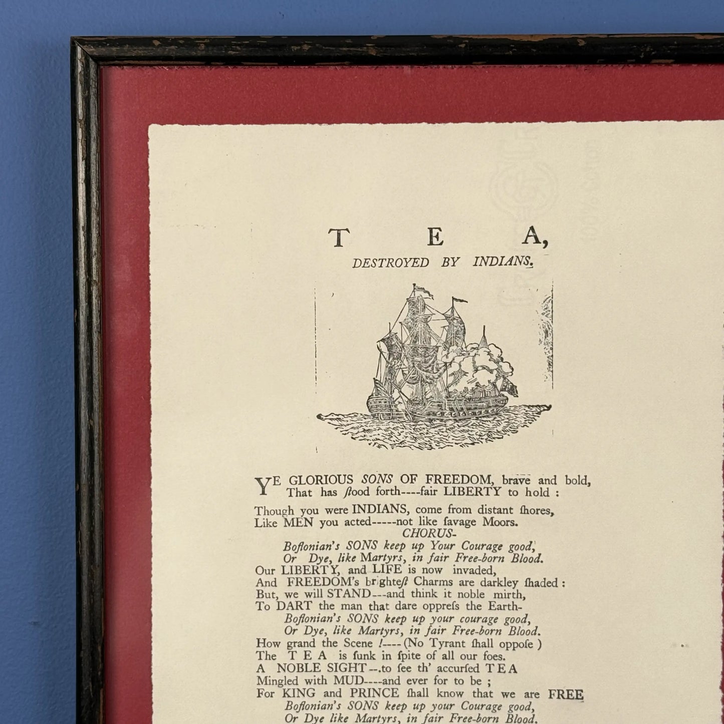 Framed "Tea Destroyed by Indians" reproduction print in an antique frame