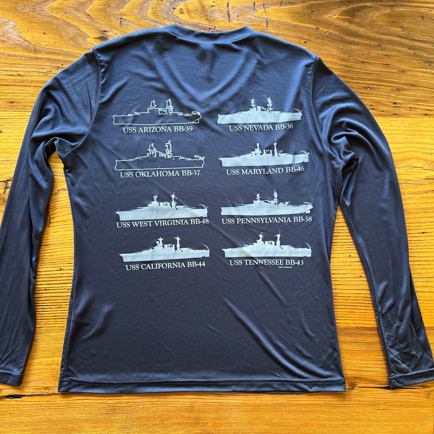 Back of the Pearl Harbor “Battleship Row” on moisture-wicking 100% polyester interlock with SPF 40+ UV protection - Long-sleeve from the History List Store