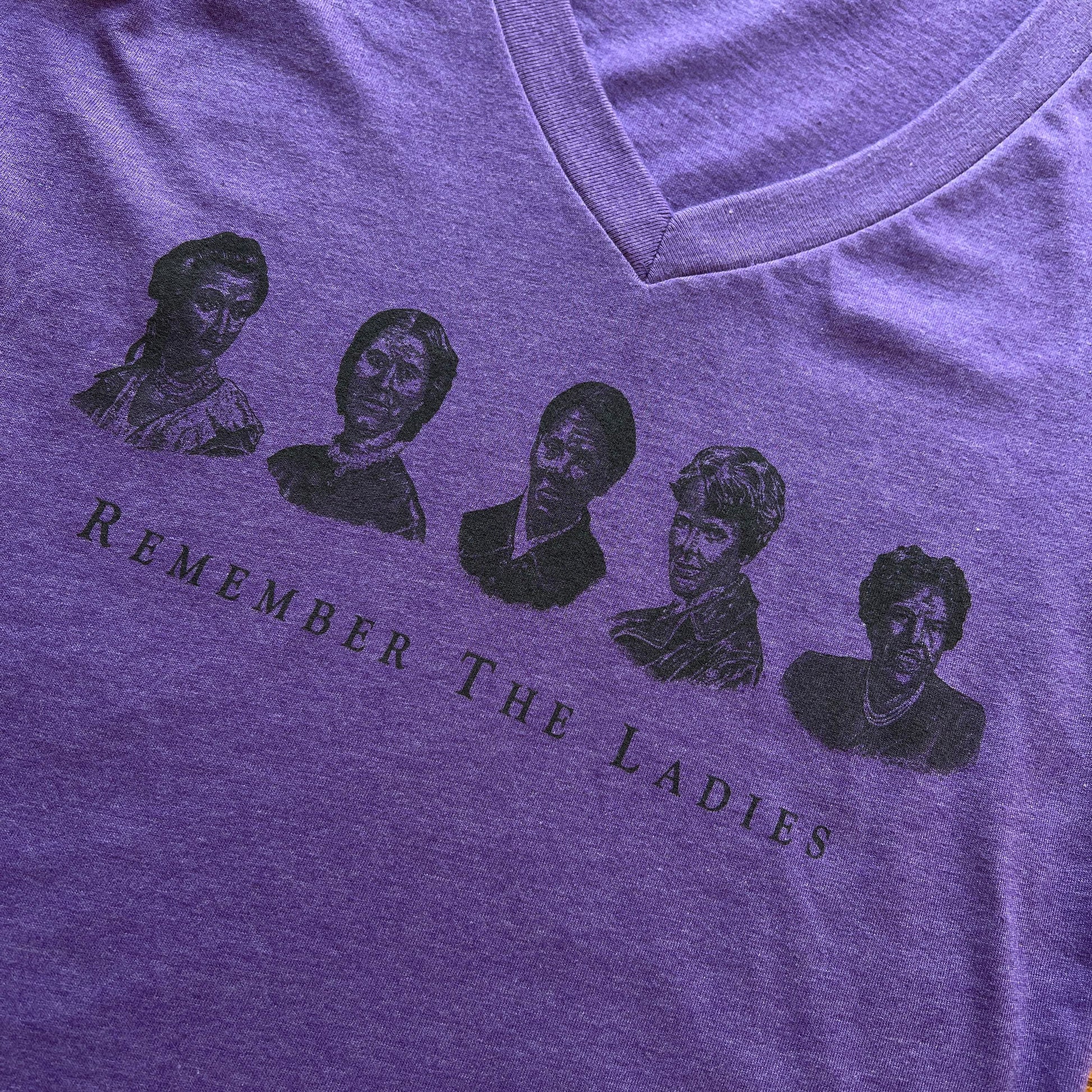 Close-up of "Remember the Ladies" Women's v-neck shirt — Straight design from The History List store in Purple