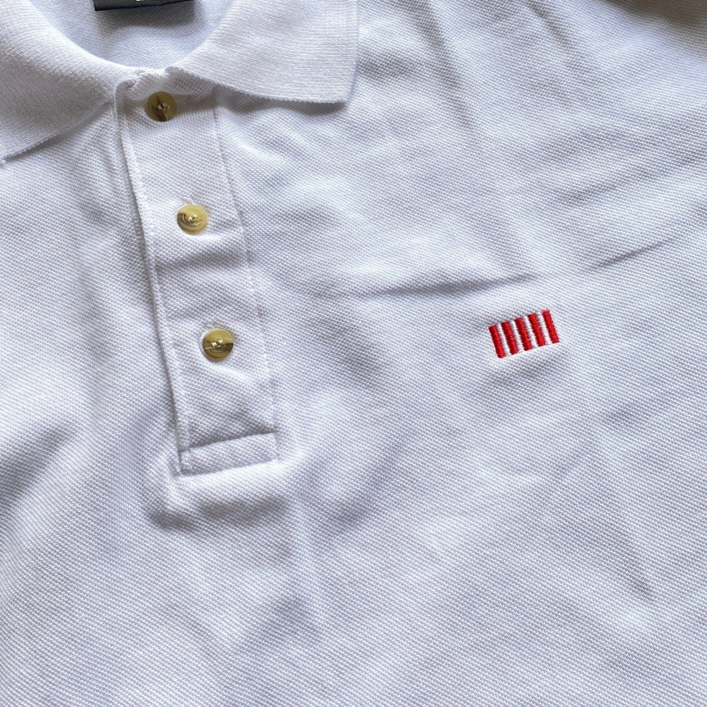 Close-up White "Sons of Liberty" 1776 Polo shirt from the History List Store.