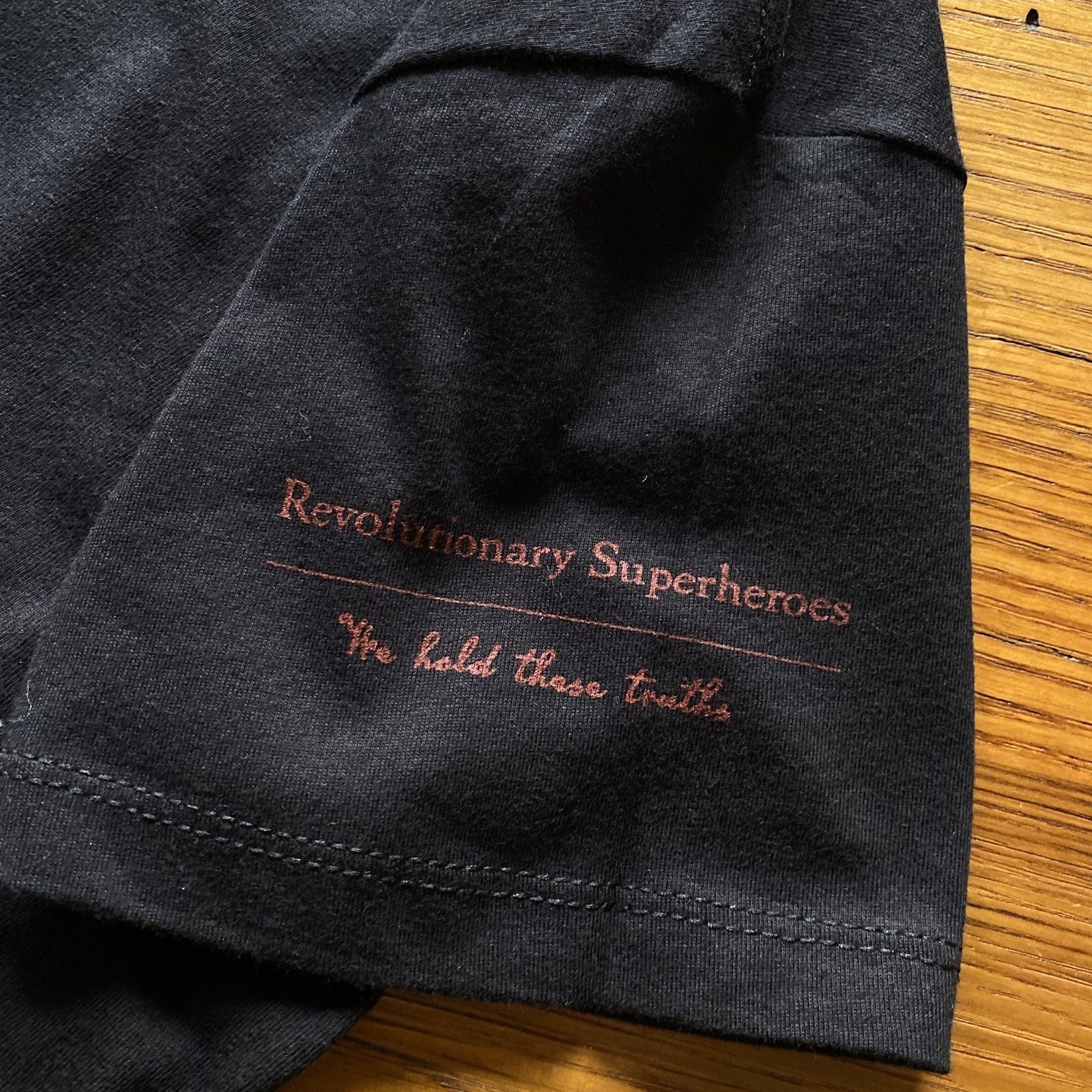 Sleeve Print Ten "Revolutionary Superheroes" V-neck shirt from the History List Store