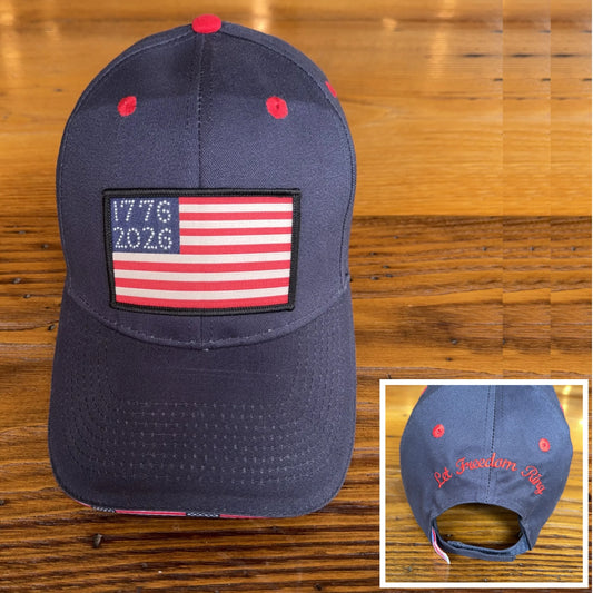 1776 - 2026 "Let Freedom Ring" cap — Dark blue with flag brim