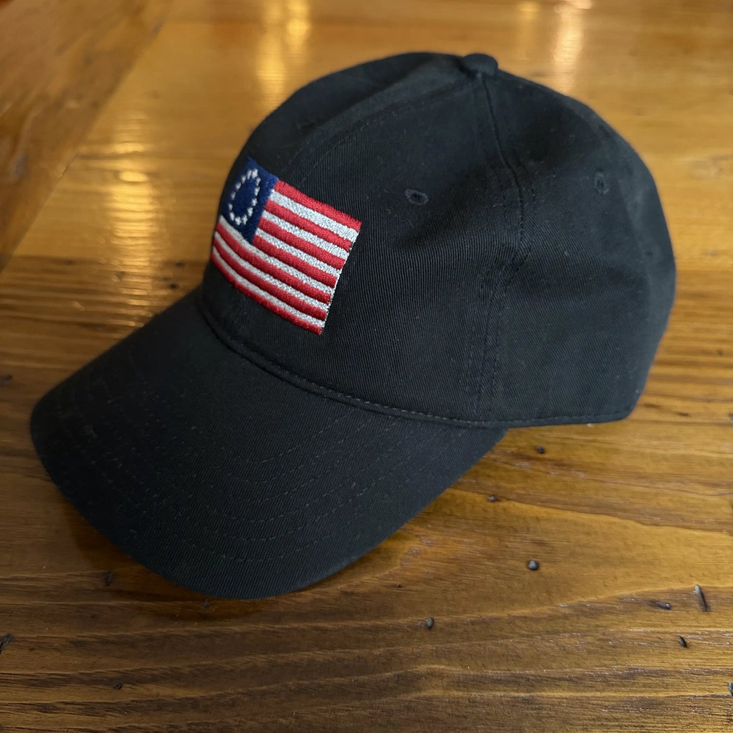 Embroidered "Betsy Ross Flag — July 4, 1776" cap — Black