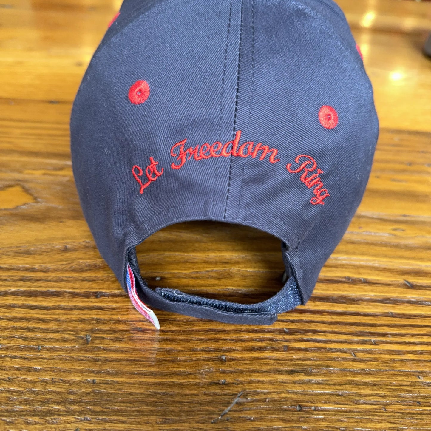 1776 - 2026 "Let Freedom Ring" cap — Dark blue with flag brim