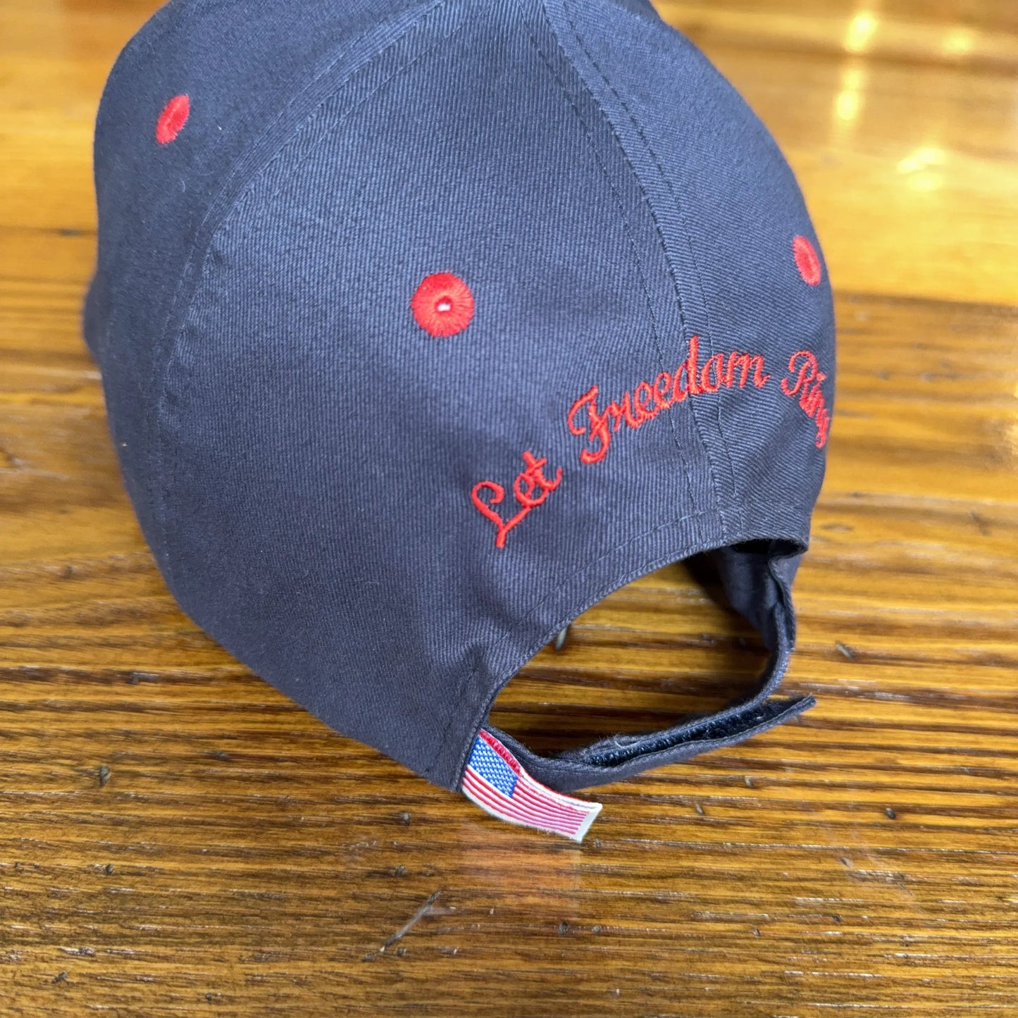 1776 - 2026 "Let Freedom Ring" cap — Dark blue with flag brim