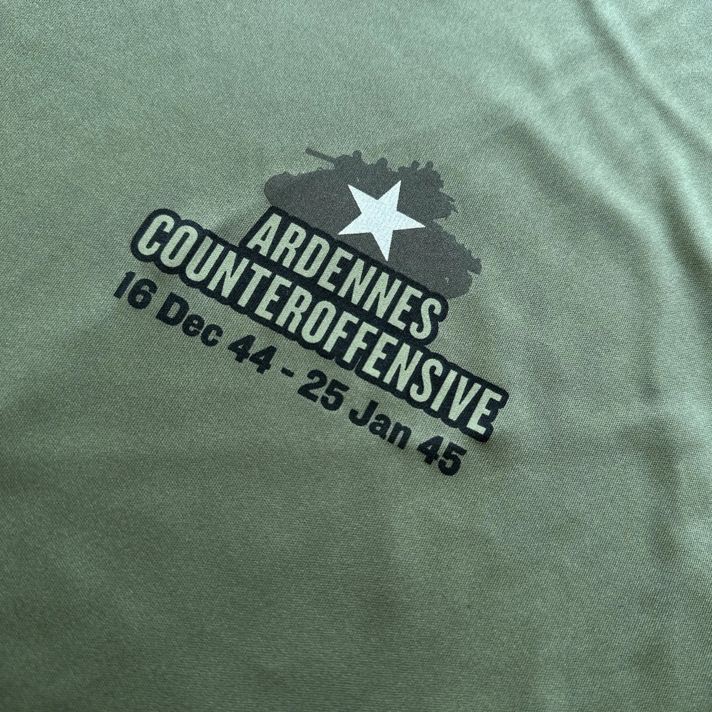 Close-up of the front of The Battle of the Bulge moisture-wicking UV shirt from The History List store