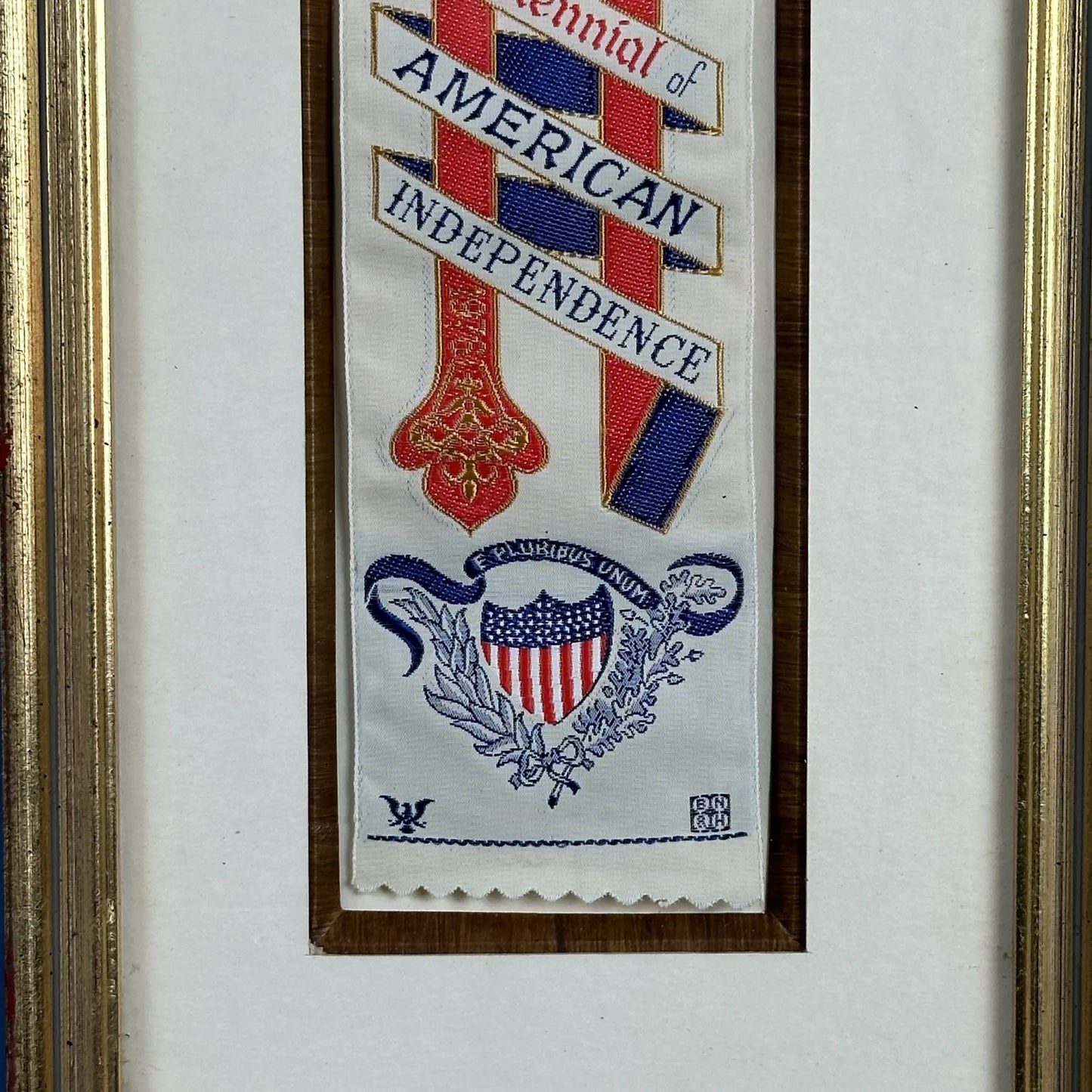 Close-up view of the text 'E Pluribus Unum' and details on the George Washington Bicentennial Silk Stevengraph Ribbon — framed, from The History List Store.