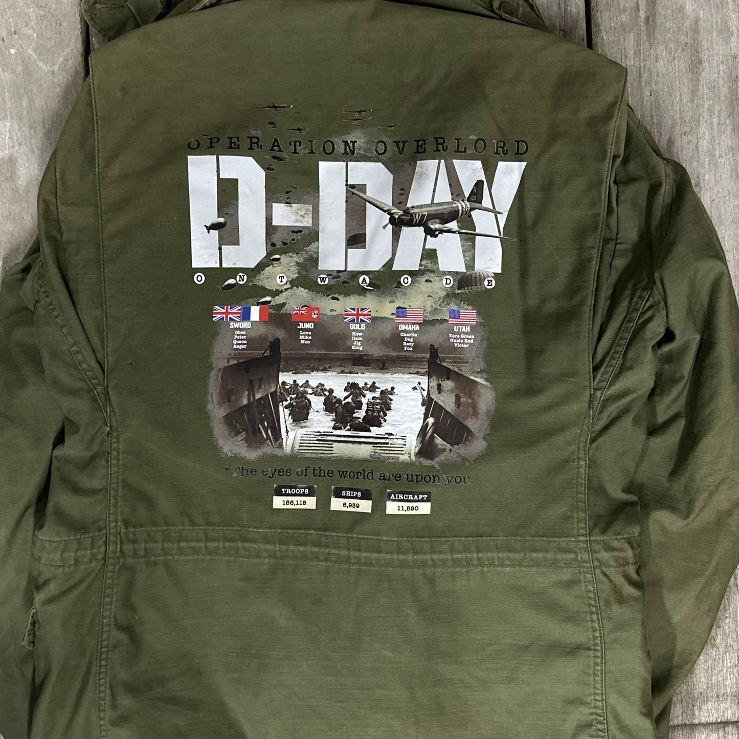 M65 Army field coats with original D-Day Operation Overlord design and a 48-star flag