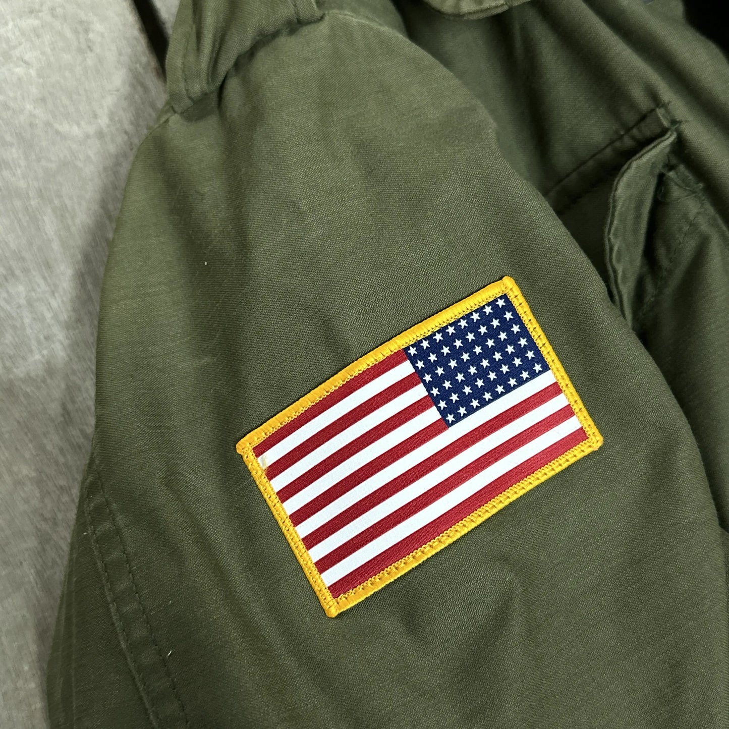 Army field coats with original D-Day design and a 48-star flag