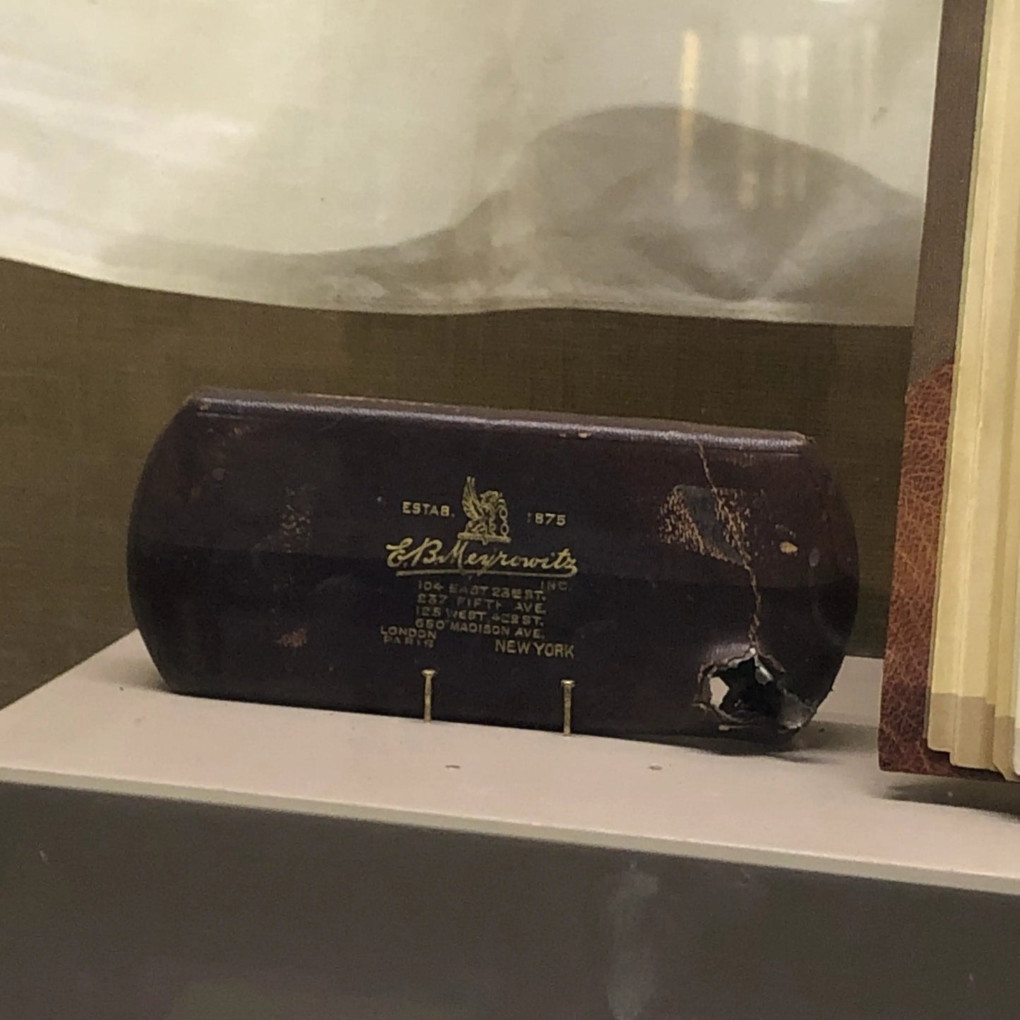 Photo taken by Lee, the recreated boyhood home of Roosevelt in New York that show glass case, that slowed the bullet when Roosevelt was shot as he was arriving to give a speech in Milwaukee.