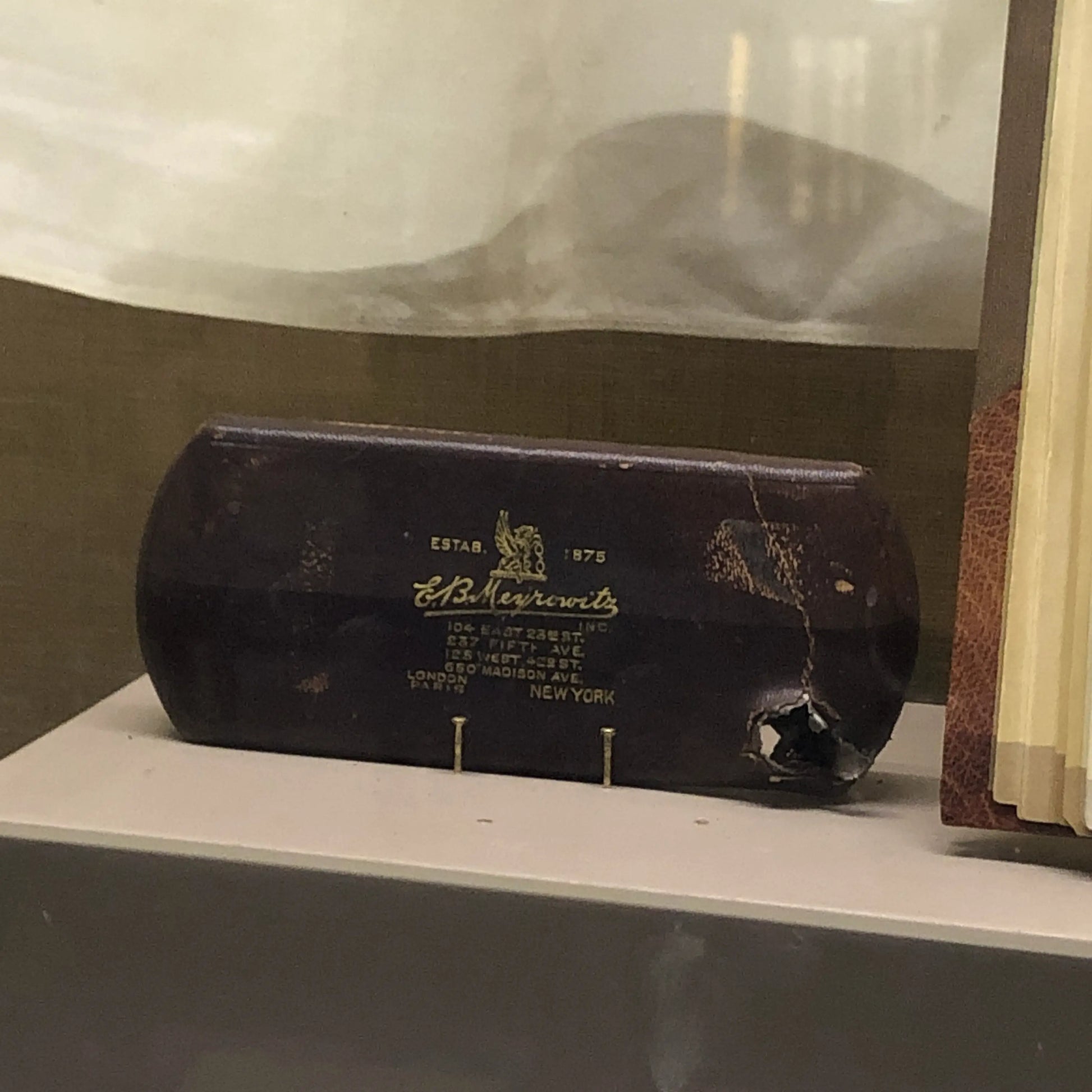 Photo taken by Lee, the recreated boyhood home of Roosevelt in New York that show glass case, that slowed the bullet when Roosevelt was shot as he was arriving to give a speech in Milwaukee.
