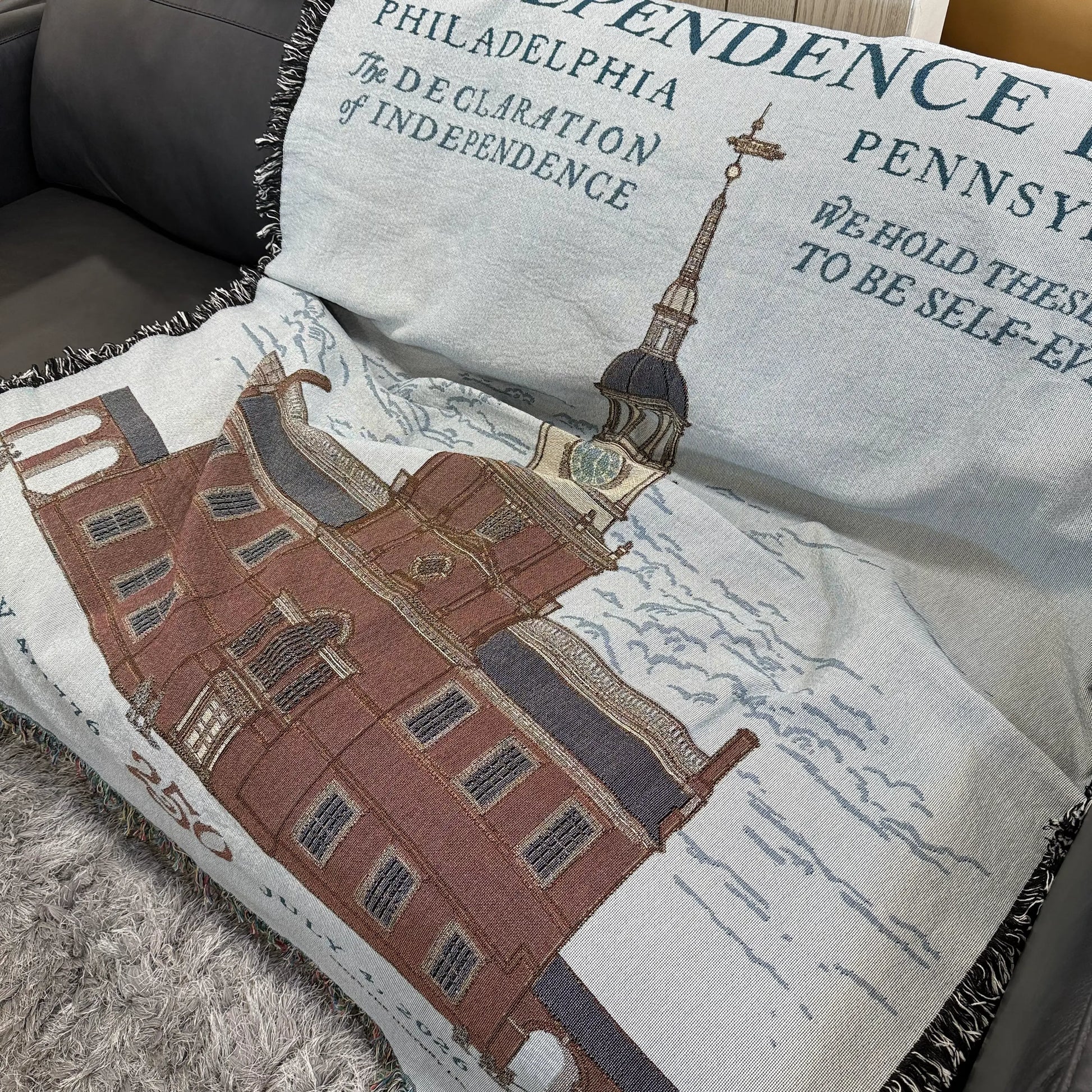 Independence Hall Made in America woven blanket from The History List store laid out in sofa