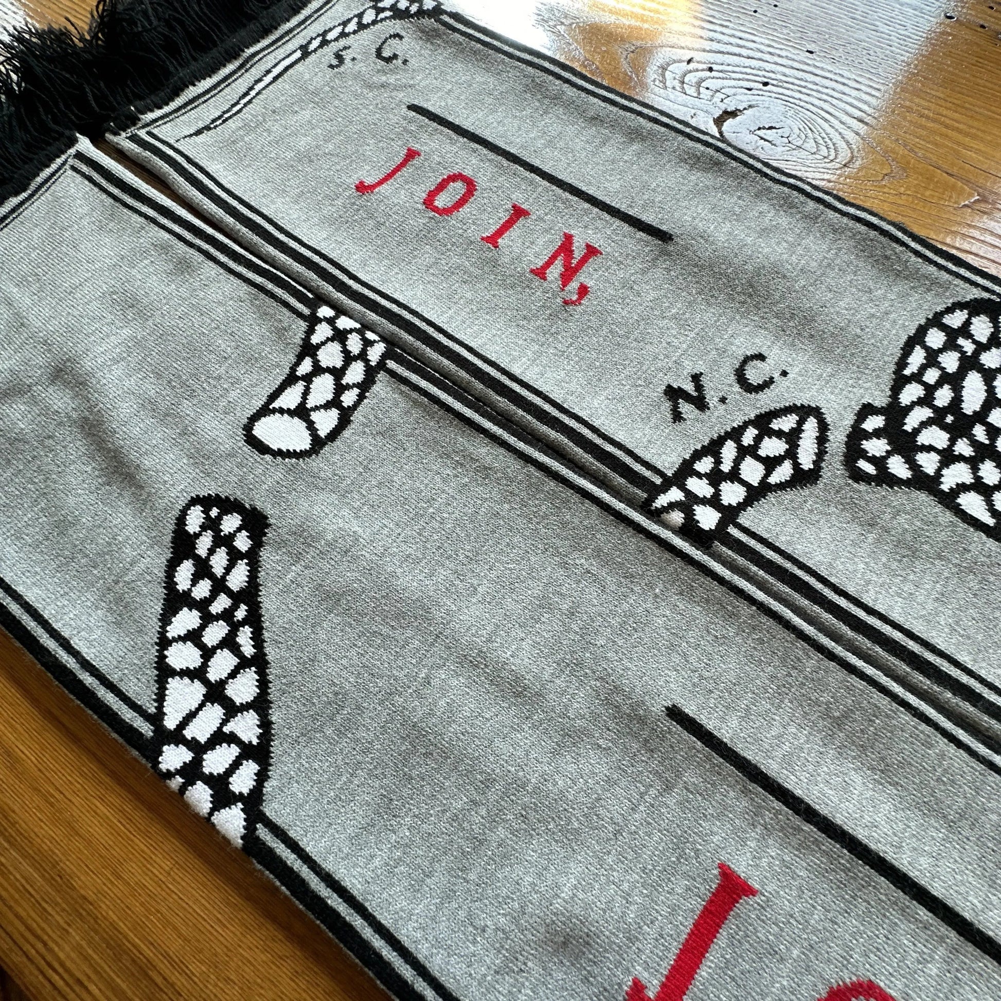Close-up of "Join or Die" woven scarf — Made in America from The History List store