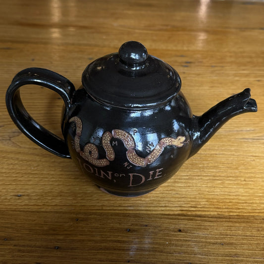 Top view of the "Join or Die" Teapot — Traditional redware made by hand in America from The History List store