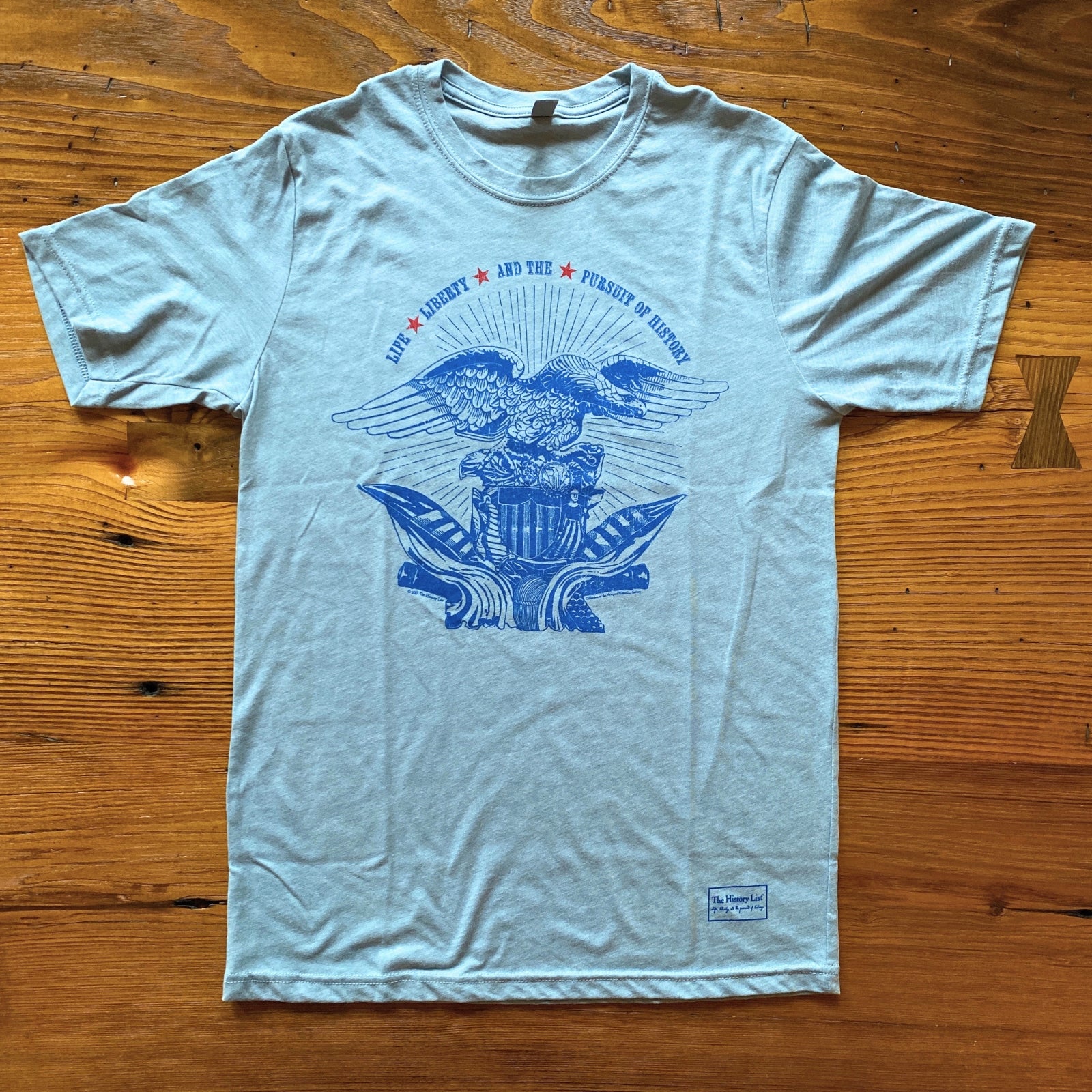 Light blue heather of the "Life, liberty, and the pursuit of history" T-Shirt from The History List store