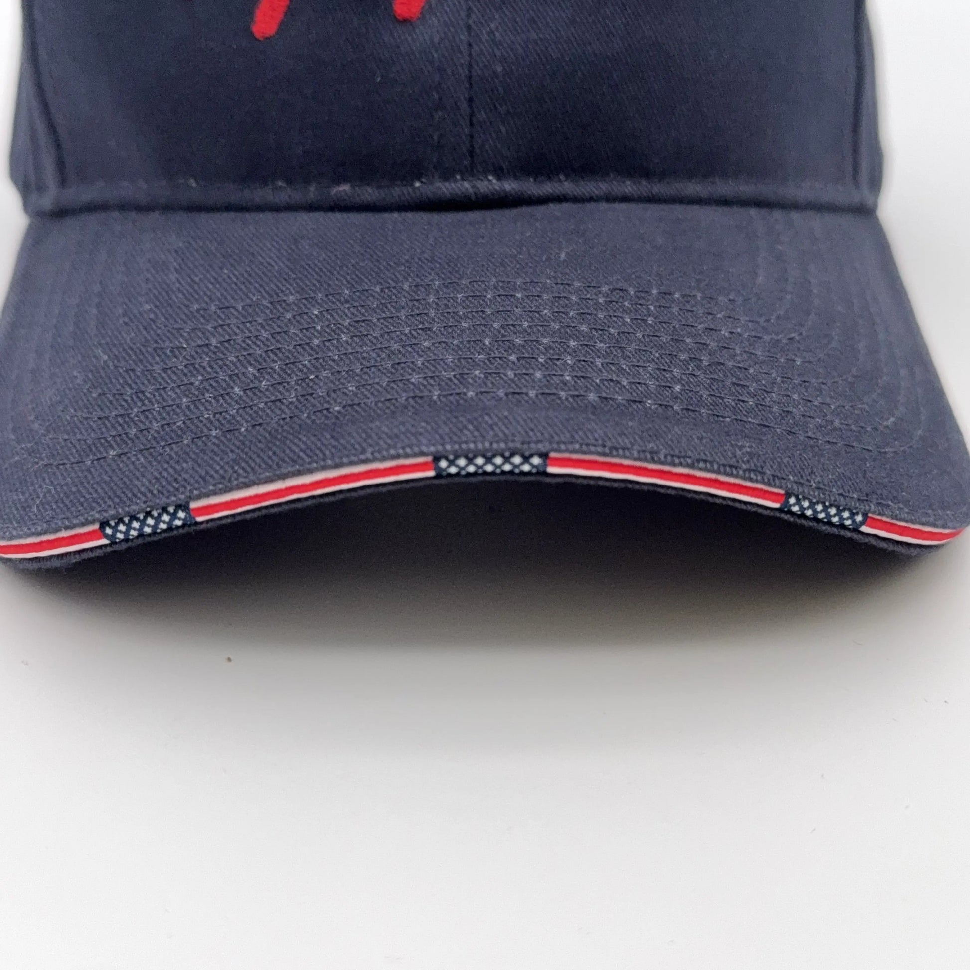 Close-up of brim of the navy Embroidered "Our Sacred Honor" Declaration of Independence 1776 cap from The History List Store