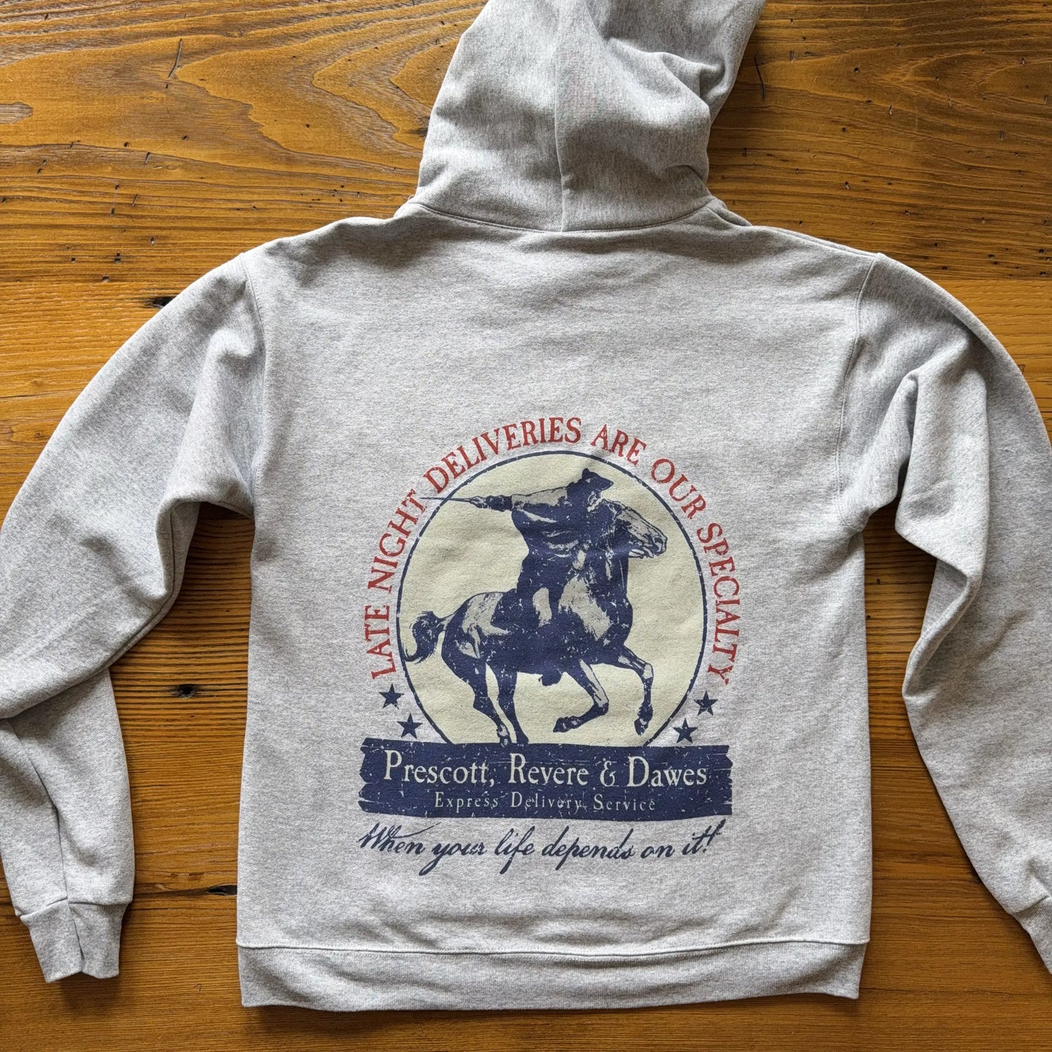 Back view of the "Prescott, Revere & Dawes Express Delivery Service" Hooded sweatshirt from The History List Store.