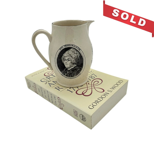 Small creamware pitcher with George Washington and Benjamin Franklin