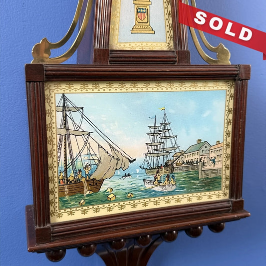 Seth Thomas "Banjo Clock" showing the Boston Tea Party — Electric (possibly)