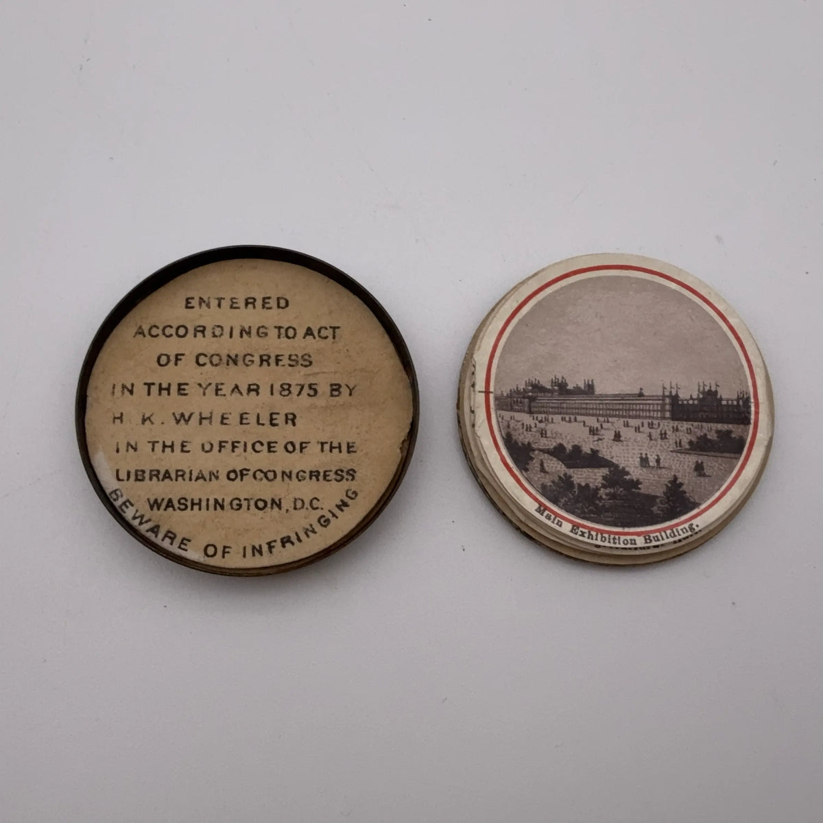 Centennial "token" with 14 small photos of Philadelphia historic sites enclosed
