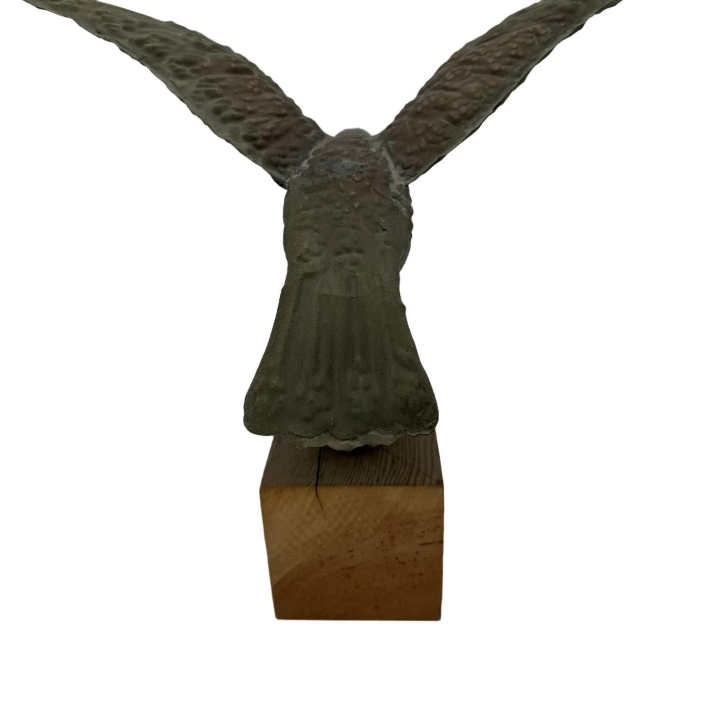 Copper eagle on ball on wooden block