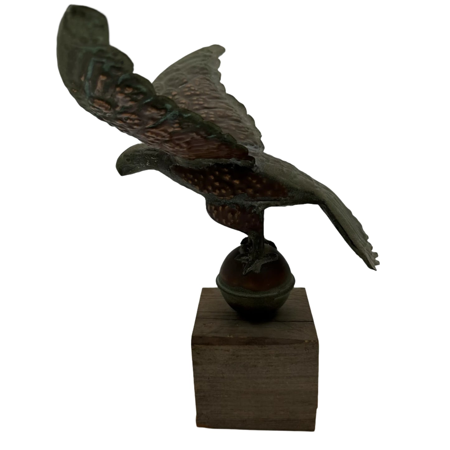 Copper eagle on ball on wooden block