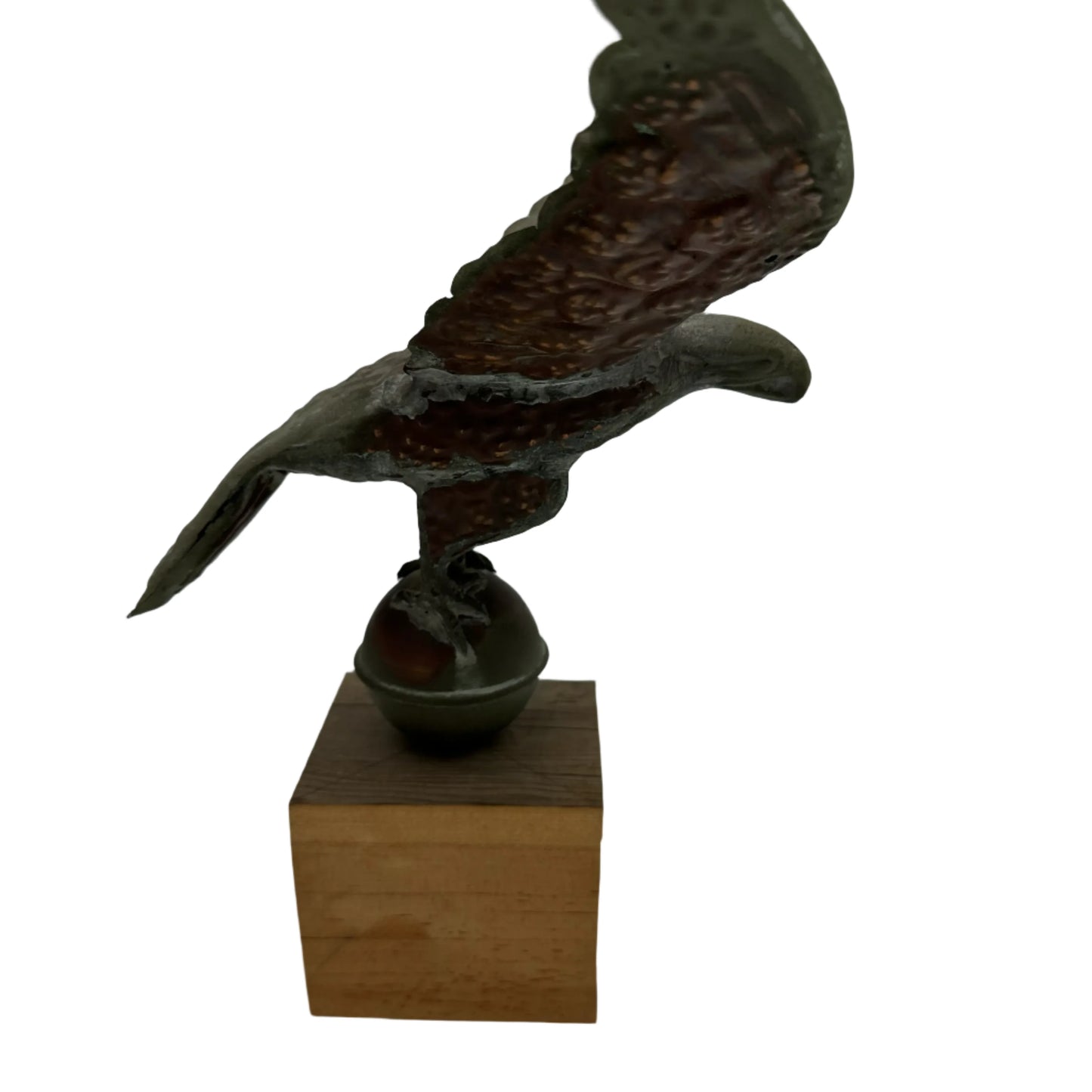 Copper eagle on ball on wooden block