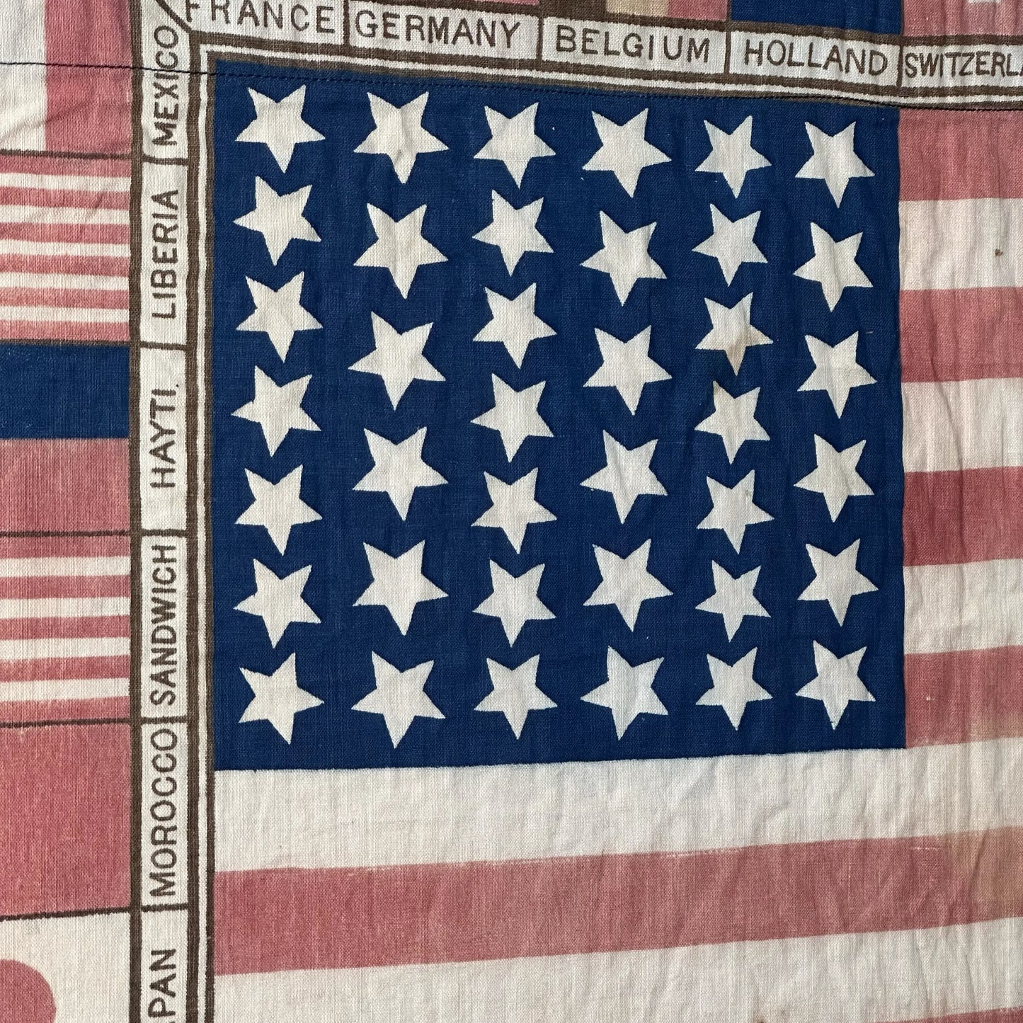 Printed for the 1875 Centennial Exhibition: US flag surrounded with the flags of participating nations — Framed