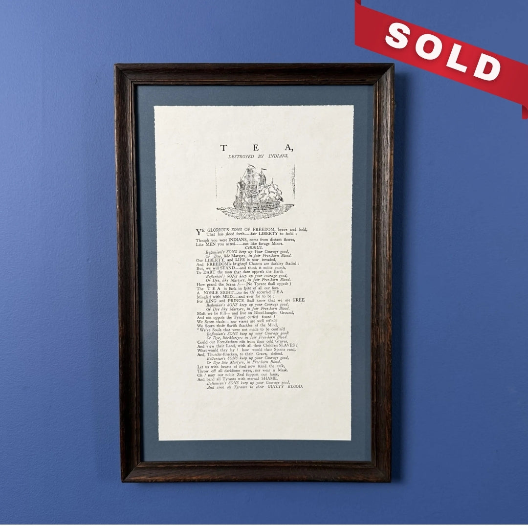 Framed "Tea Destroyed by Indians" reproduction print in an antique frame