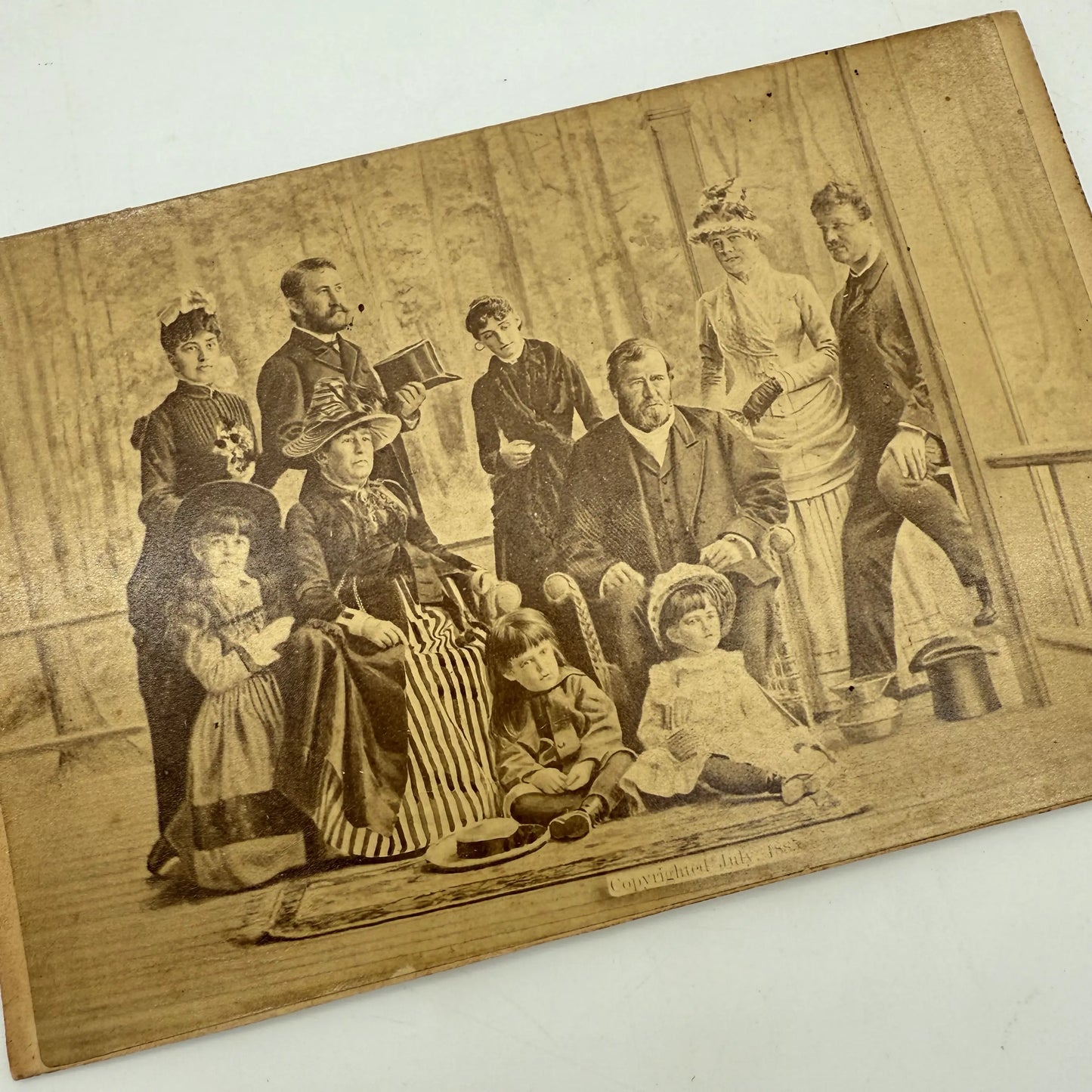 Photograph of Grant and his family on their porch shortly before his death — Framed